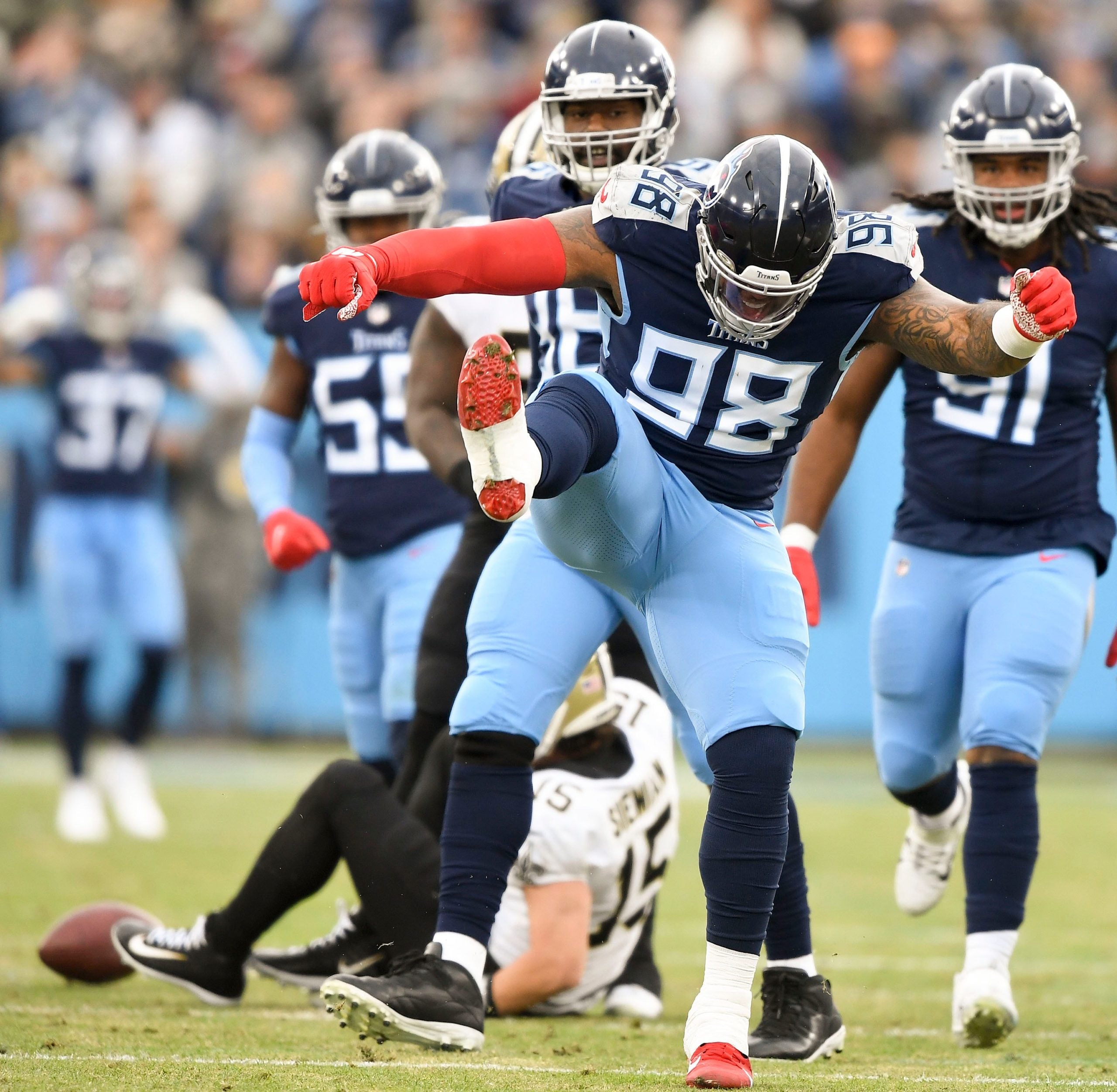 Tennessee Titans defensive tackle Jeffery Simmons (98) celebrates after sacking New Orleans Saints quarterback Trevor Siemian (15) during the first quarter at Nissan Stadium Sunday, Nov. 14, 2021 in Nashville, Tenn. Titans Saints 1304