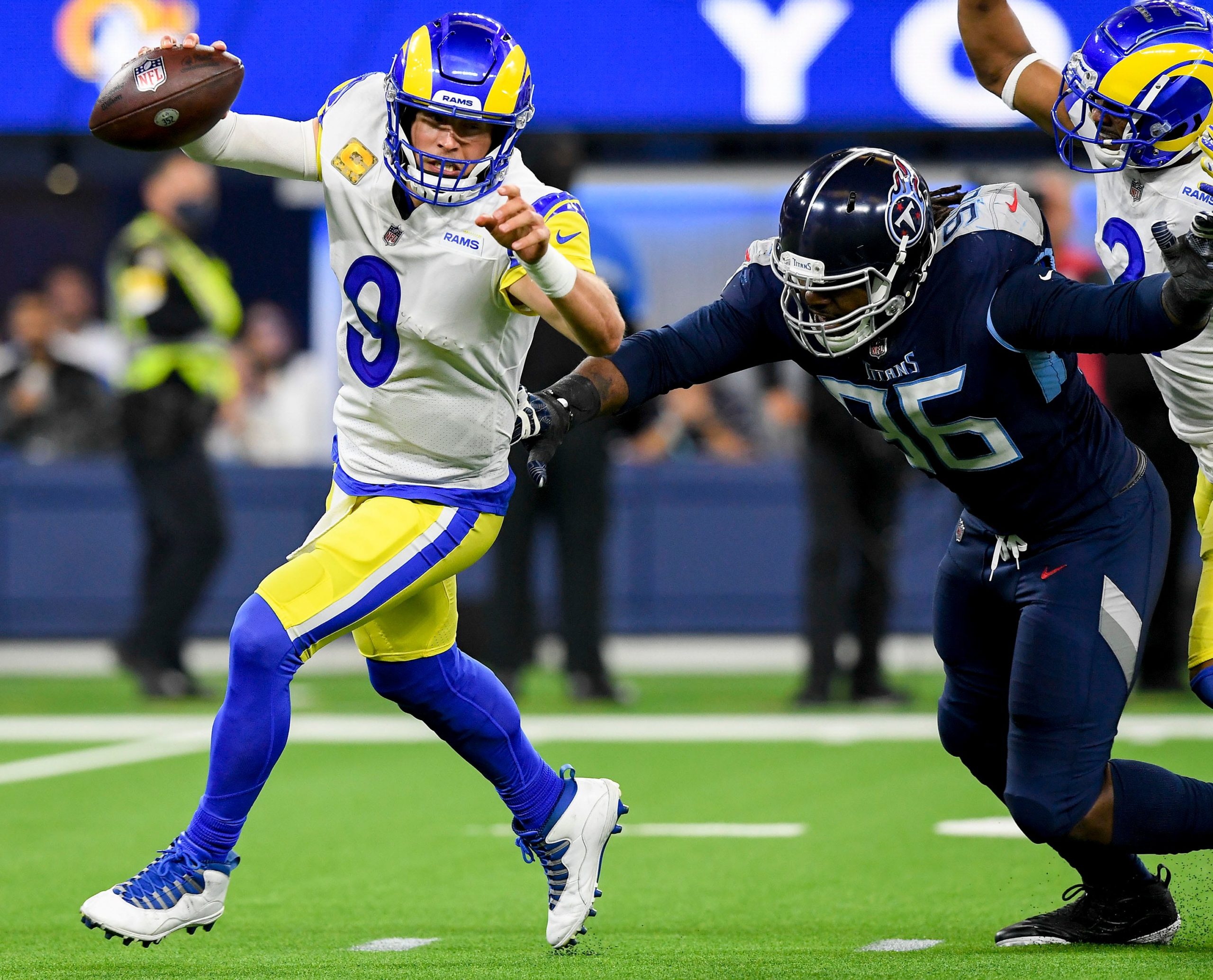 Los Angeles Rams quarterback Matthew Stafford (9) is pressured by Tennessee Titans defensive end Denico Autry (96) during the third quarter at SoFI Stadium Sunday, Nov. 7, 2021 in Inglewood, Calif. Titans Rams 089