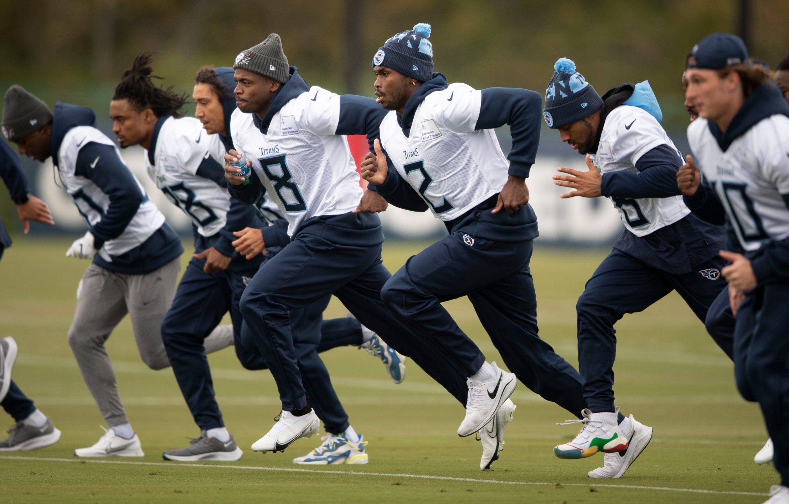 Tennessee Titans running back Adrian Peterson (8) and wide receiver Julio Jones (2) run sprints with teammates during practice at Saint Thomas Sports Park Wednesday, Nov. 3, 2021 in Nashville, Tenn. Nas Titans Practice 018