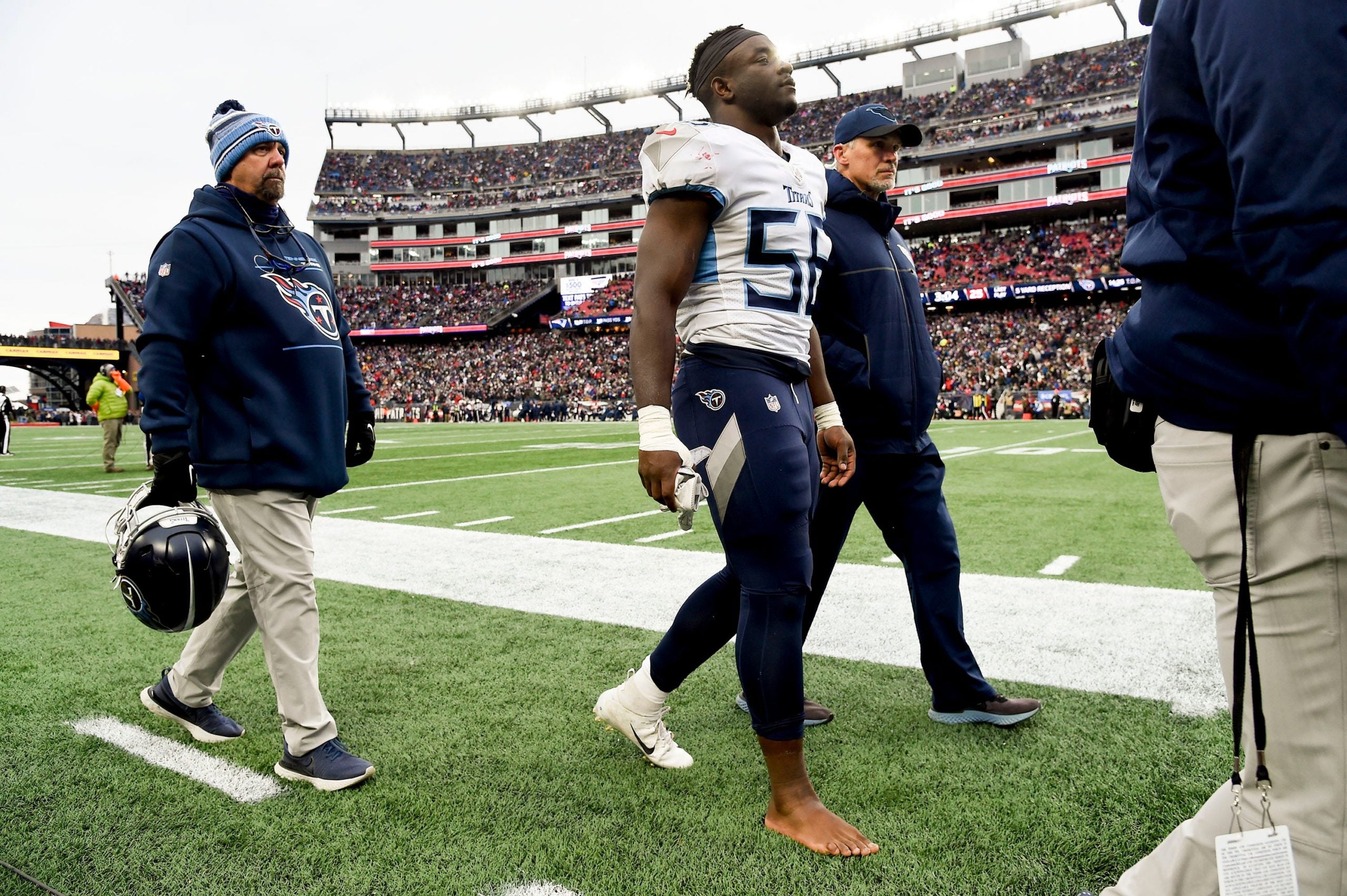 Tennessee Titans linebacker Monty Rice (56) leads the field after an injury during the second quarter at Gillette Stadium Sunday, Nov. 28, 2021 in Foxborough, Mass. Titans Patriots 102