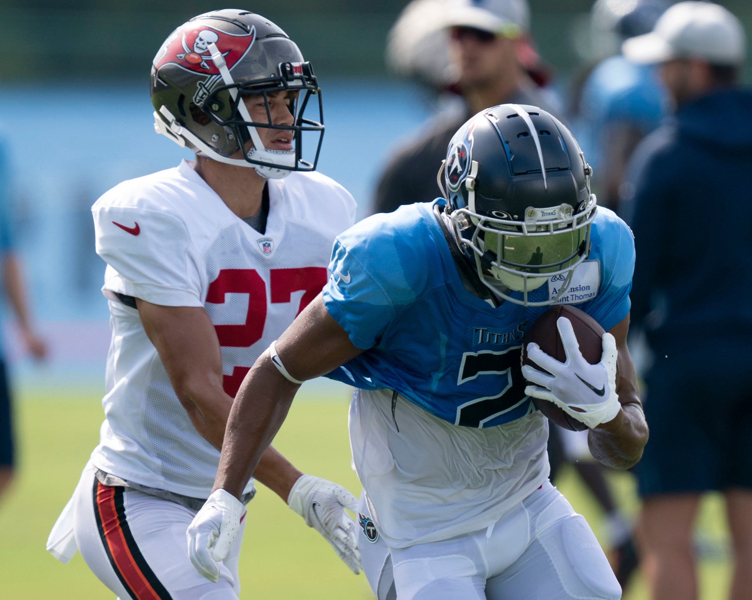 Aug 17, 2022; Nashville, Tennessee;  Tennessee Titans wide receiver Robert Woods (2) races up the field with a catch past Tampa Bay Buccaneers cornerback Zyon McCollum (27) during a joint training camp practice at Ascension Saint Thomas Sports Park. Mandatory Credit: George Walker IV-USA TODAY Sports