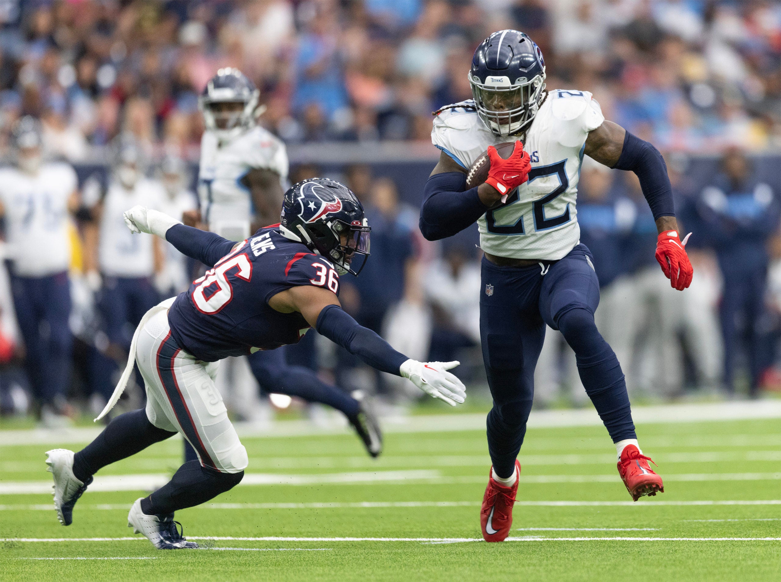 Oct 30, 2022; Houston, Texas, USA;  Tennessee Titans running back Derrick Henry (22) rushes for a touchdown against Houston Texans safety Jonathan Owens (36) in the second quarter at NRG Stadium. Mandatory Credit: Thomas Shea-USA TODAY Sports