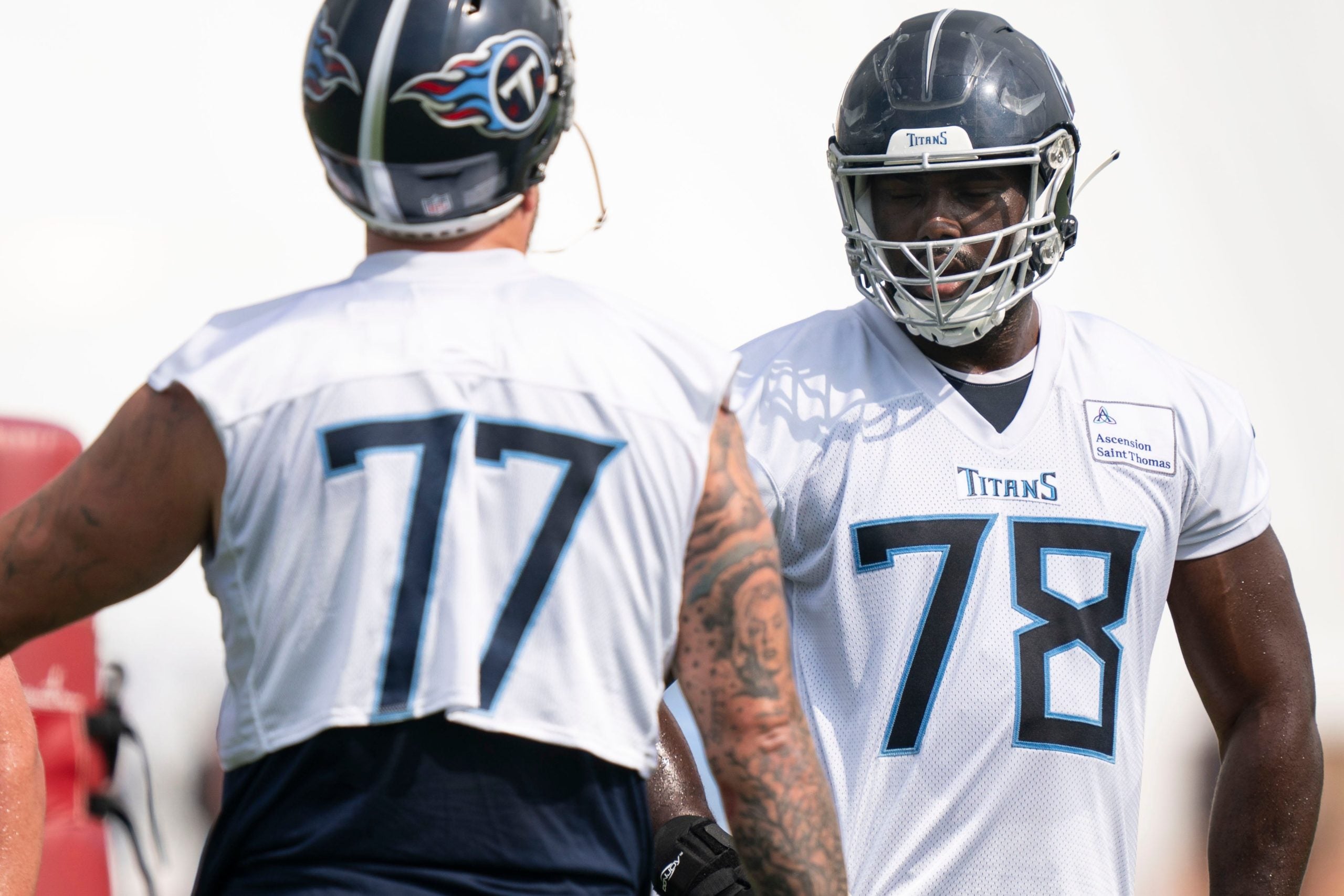 Tennessee Titans offensive lineman Nicholas Petit-Frere (78) takes instruction from offensive tackle Taylor Lewan (77) during practice at Saint Thomas Sports Park Tuesday, June 7, 2022, in Nashville, Tenn. Nas Titans Ota 024
