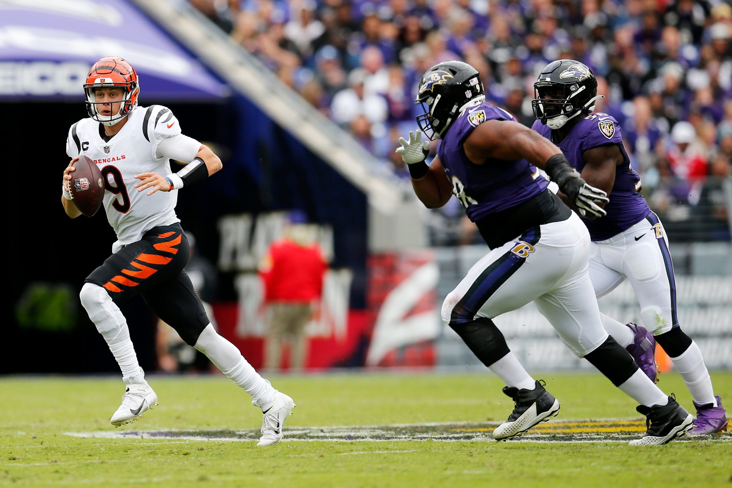 Cincinnati Bengals quarterback Joe Burrow (9) scrambles out of the pocket in the first quarter of the NFL Week 7 game between the Baltimore Ravens and the Cincinnati Bengals at M&T Bank Stadium in Baltimore on Sunday, Oct. 24, 2021. The Bengals led 13-10 at halftime. Cincinnati Bengals At Baltimore Ravens Week 7