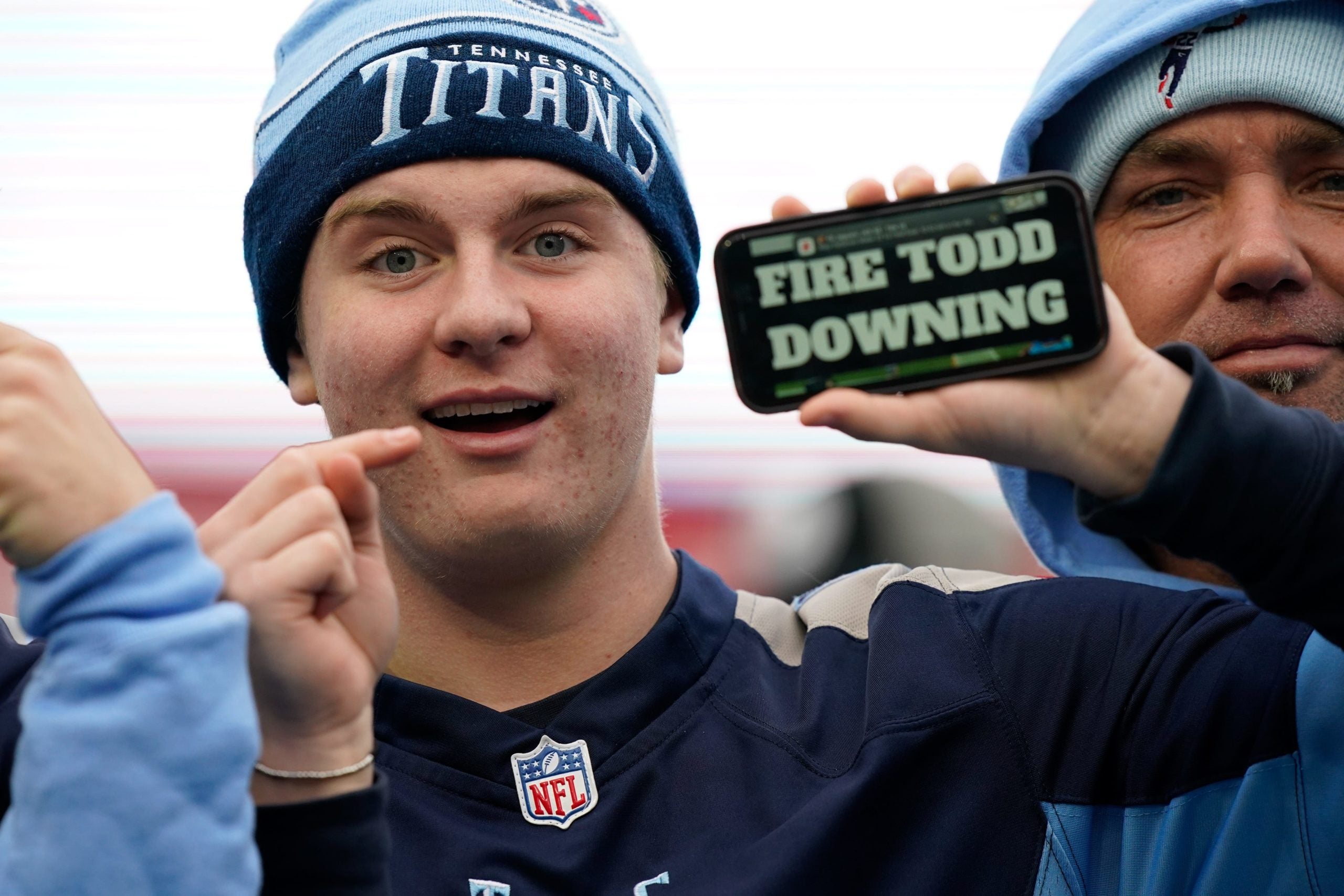 A Titans fan holds a 