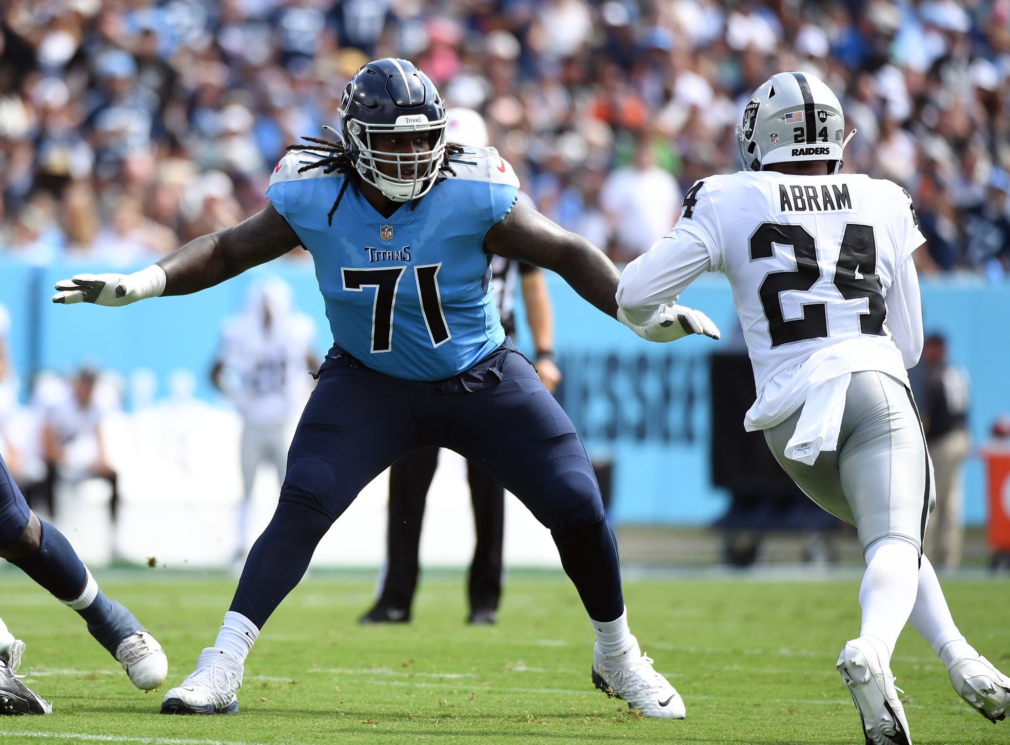 Sep 25, 2022; Nashville, Tennessee, USA; Tennessee Titans guard Dennis Daley (71) blocks against Las Vegas Raiders safety Johnathan Abram (24) during the first half at Nissan Stadium. Mandatory Credit: Christopher Hanewinckel-USA TODAY Sports