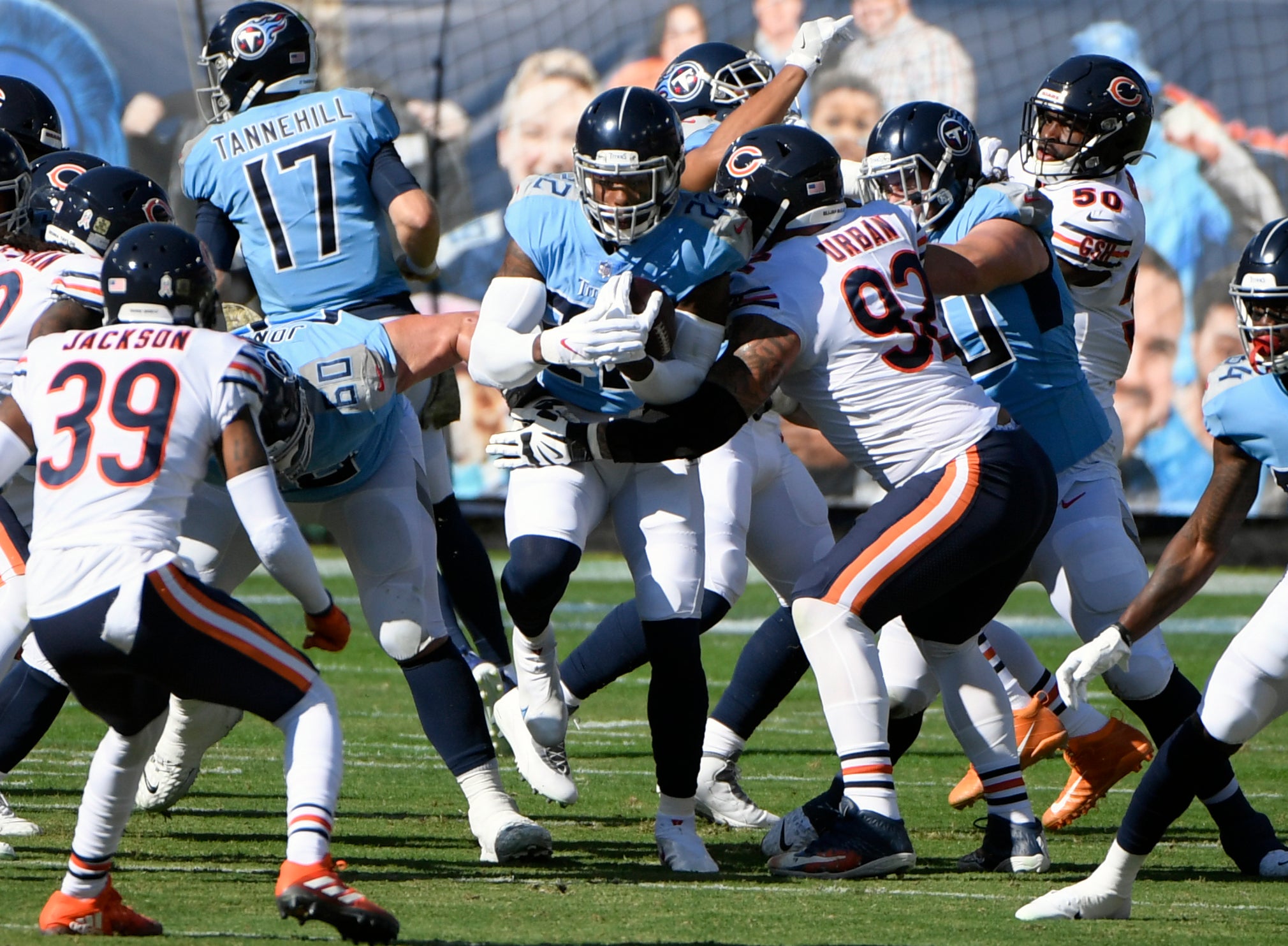 Nov 8, 2020; Nashville, Tennessee, USA;  Tennessee Titans running back Derrick Henry (22) gets tackled by Chicago Bears defensive end Brent Urban (92) as he runs up the middle during the first period at Nissan Stadium. Mandatory Credit: Steve Roberts-USA TODAY Sports
