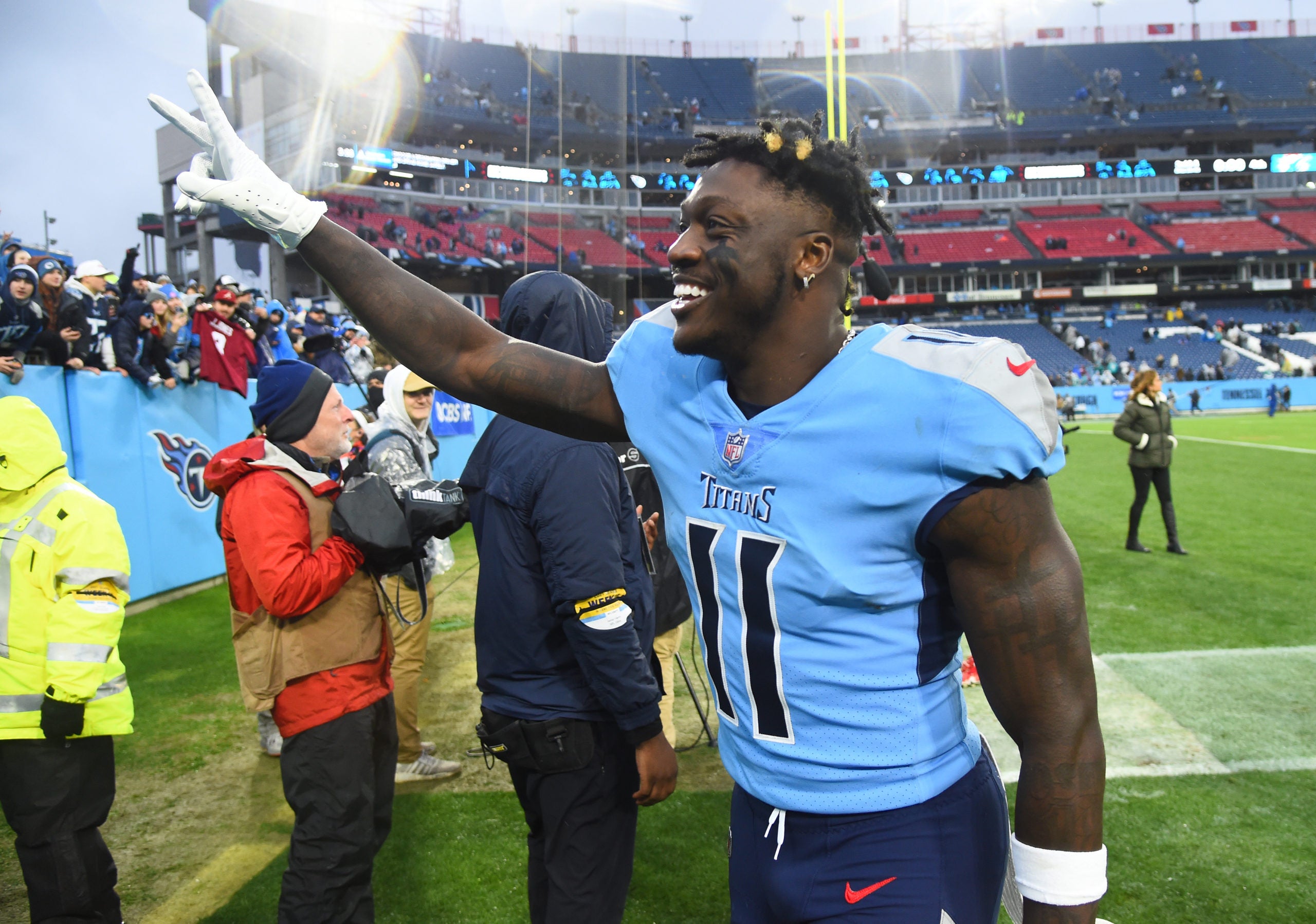 Jan 2, 2022; Nashville, Tennessee, USA; Tennessee Titans wide receiver A.J. Brown (11) celebrates after a win against the Miami Dolphins at Nissan Stadium. Mandatory Credit: Christopher Hanewinckel-USA TODAY Sports