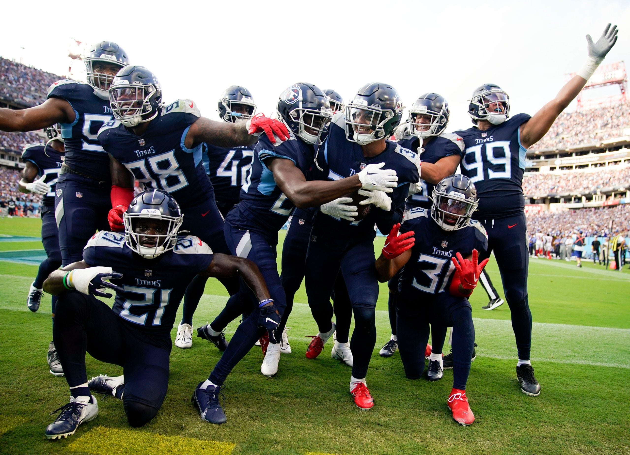 Tennessee Titans safety Amani Hooker (37), center, celebrates with his team after intercepting the ball in the end zone during the fourth quarter at Nissan Stadium Sunday, Sept. 11, 2022, in Nashville, Tenn. Nfl New York Giants At Tennessee Titans
