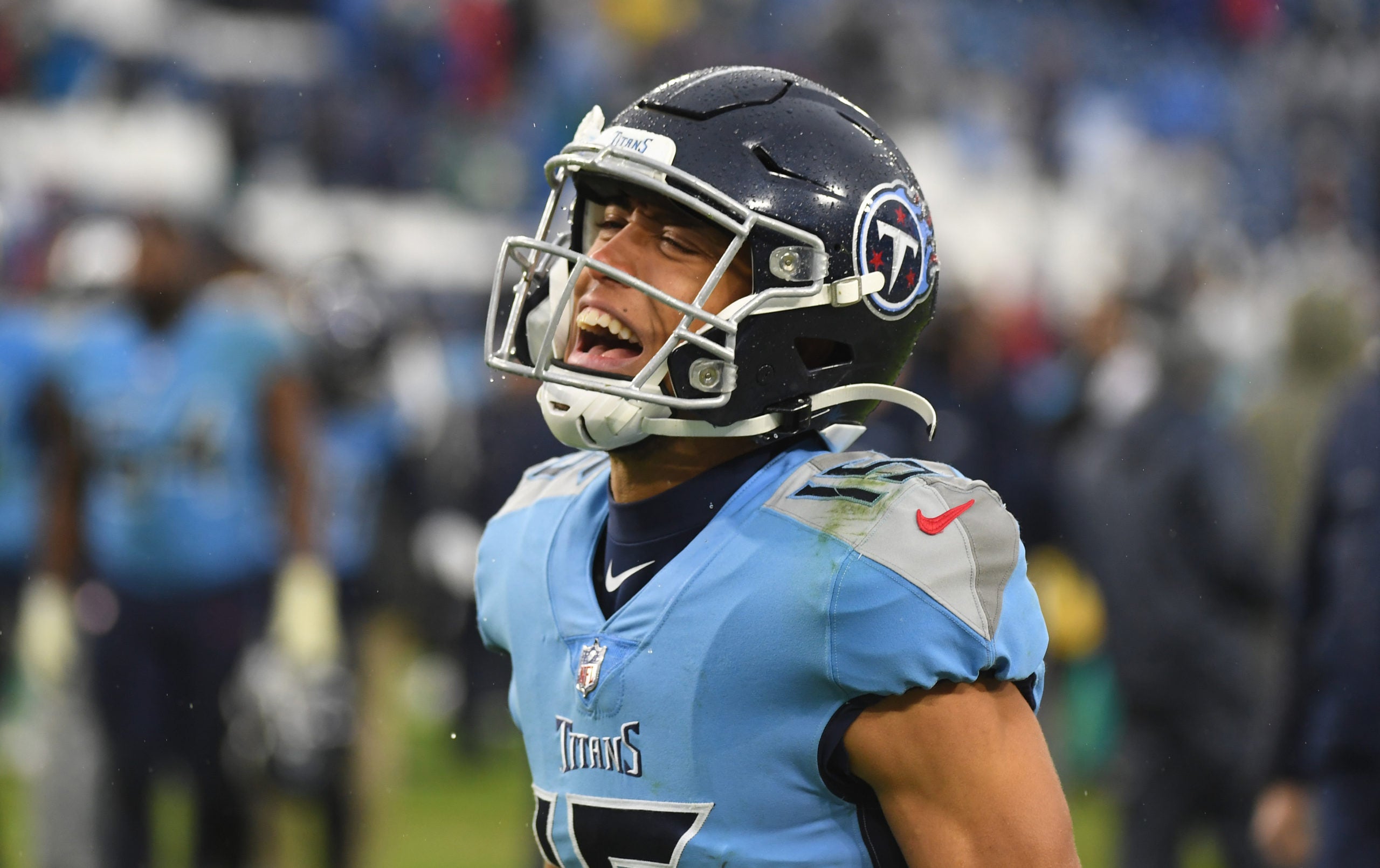 Jan 2, 2022; Nashville, Tennessee, USA; Tennessee Titans wide receiver Nick Westbrook-Ikhine (15) celebrates as he leaves the field following a win against the Miami Dolphins at Nissan Stadium. Mandatory Credit: Christopher Hanewinckel-USA TODAY Sports