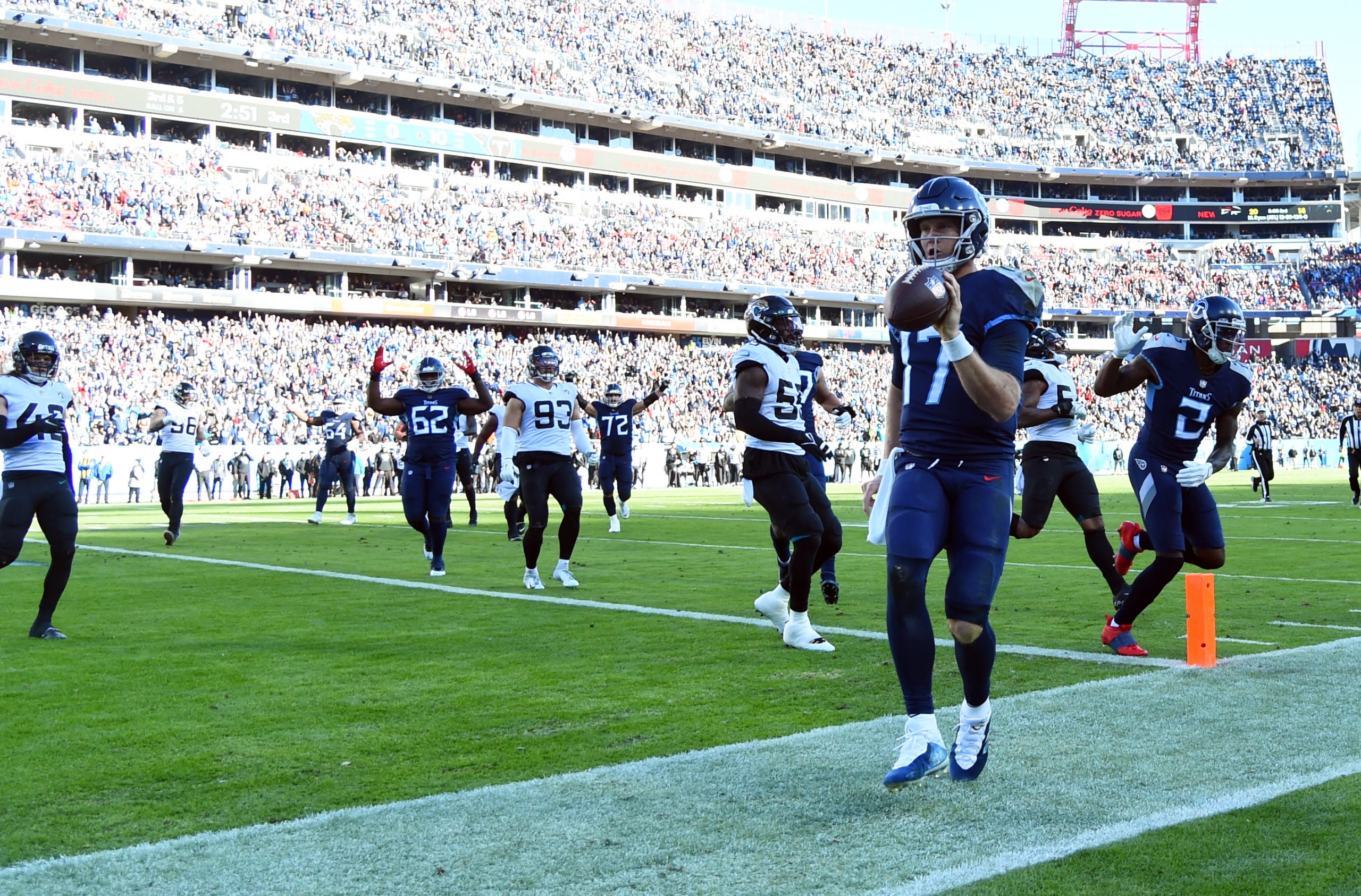 Dec 12, 2021; Nashville, Tennessee, USA; Tennessee Titans quarterback Ryan Tannehill (17) scores on a touchdown run during the second half against the Jacksonville Jaguars at Nissan Stadium. Mandatory Credit: Christopher Hanewinckel-USA TODAY Sports