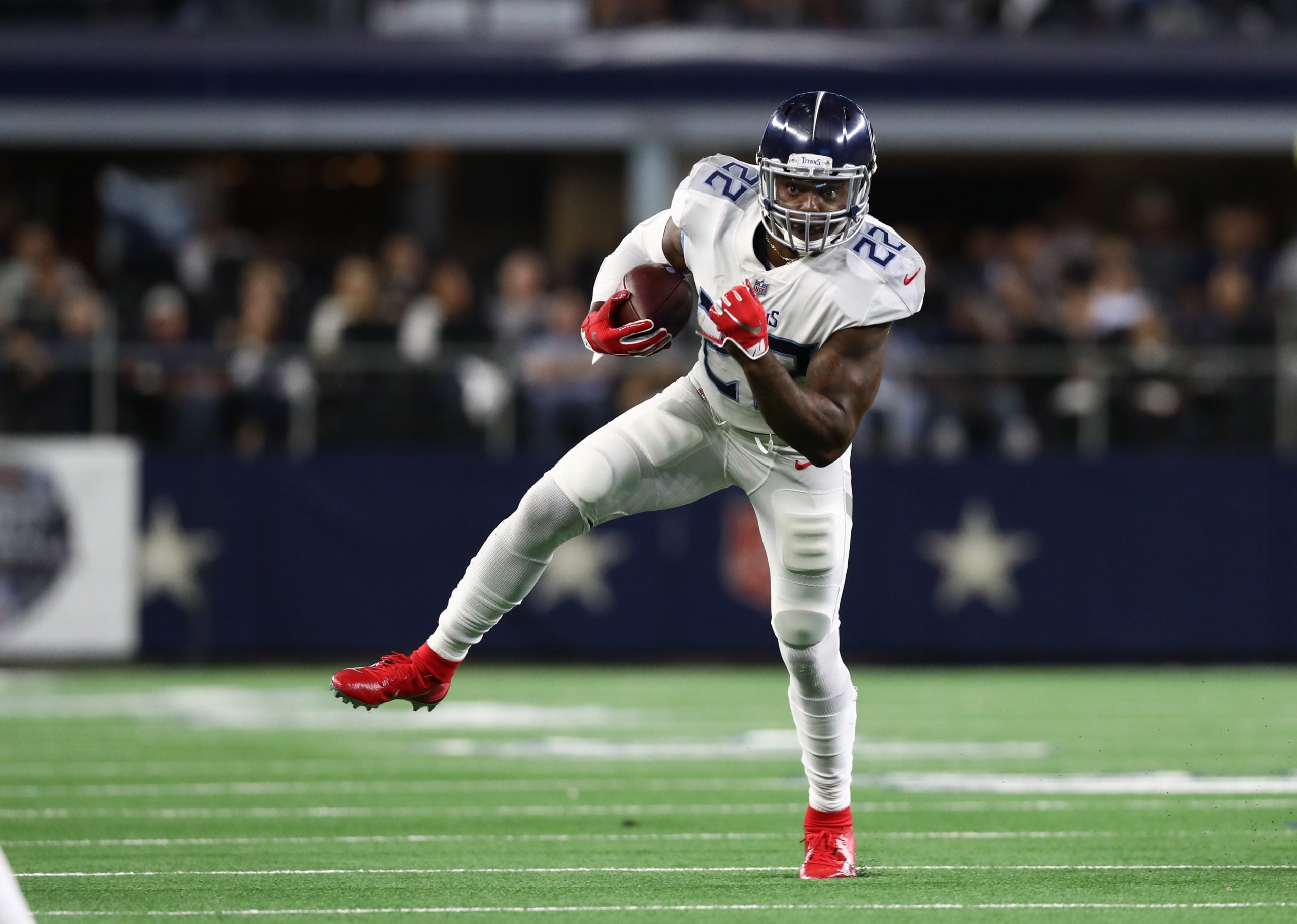 Nov 5, 2018; Arlington, TX, USA; Tennessee Titans running back Derrick Henry (22) runs with the ball against the Dallas Cowboys at AT&T Stadium. Mandatory Credit: Matthew Emmons-USA TODAY Sports