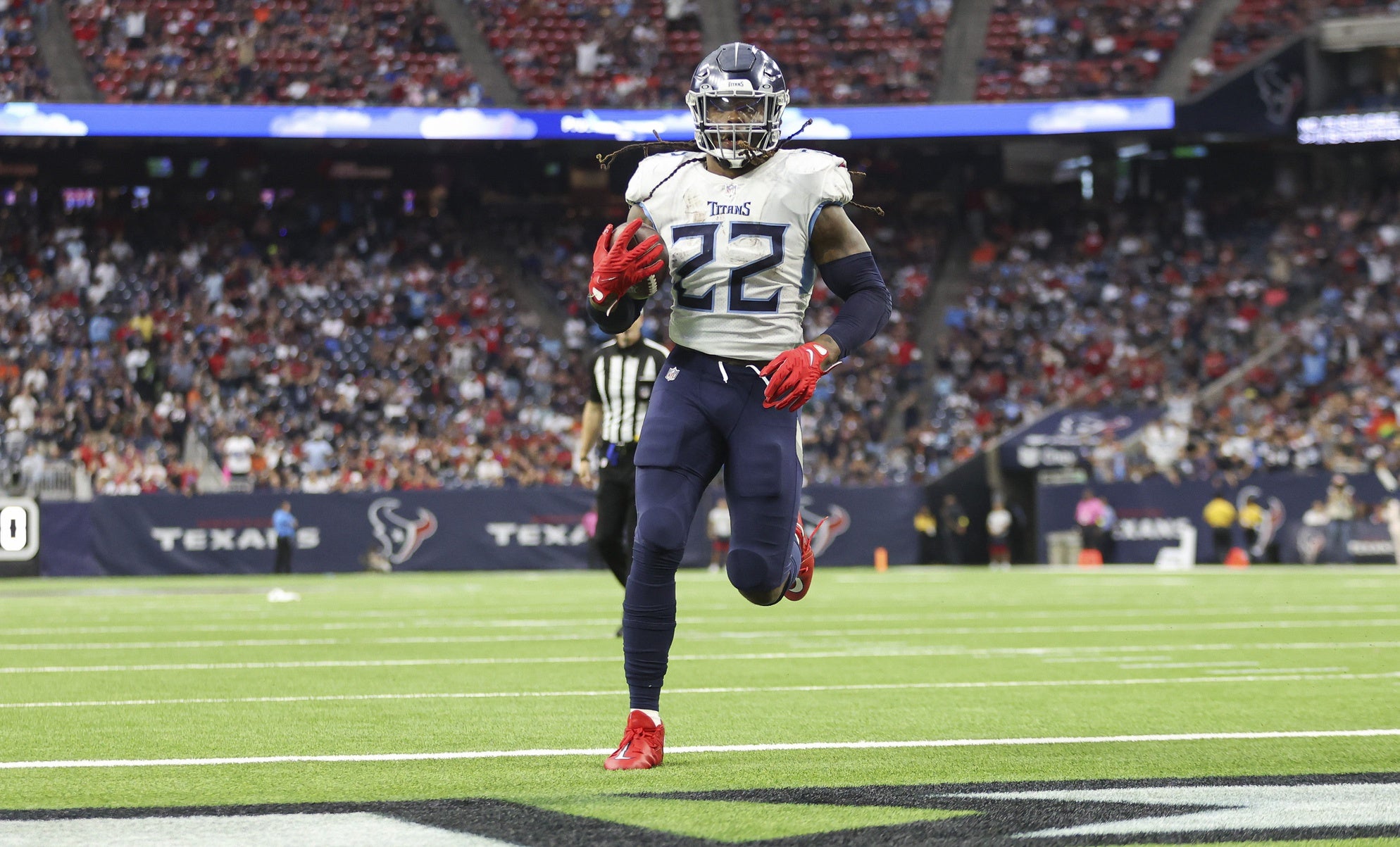 Oct 30, 2022; Houston, Texas, USA; Tennessee Titans running back Derrick Henry (22) rushes for a touchdown during the third quarter against the Houston Texans at NRG Stadium. Mandatory Credit: Troy Taormina-USA TODAY Sports