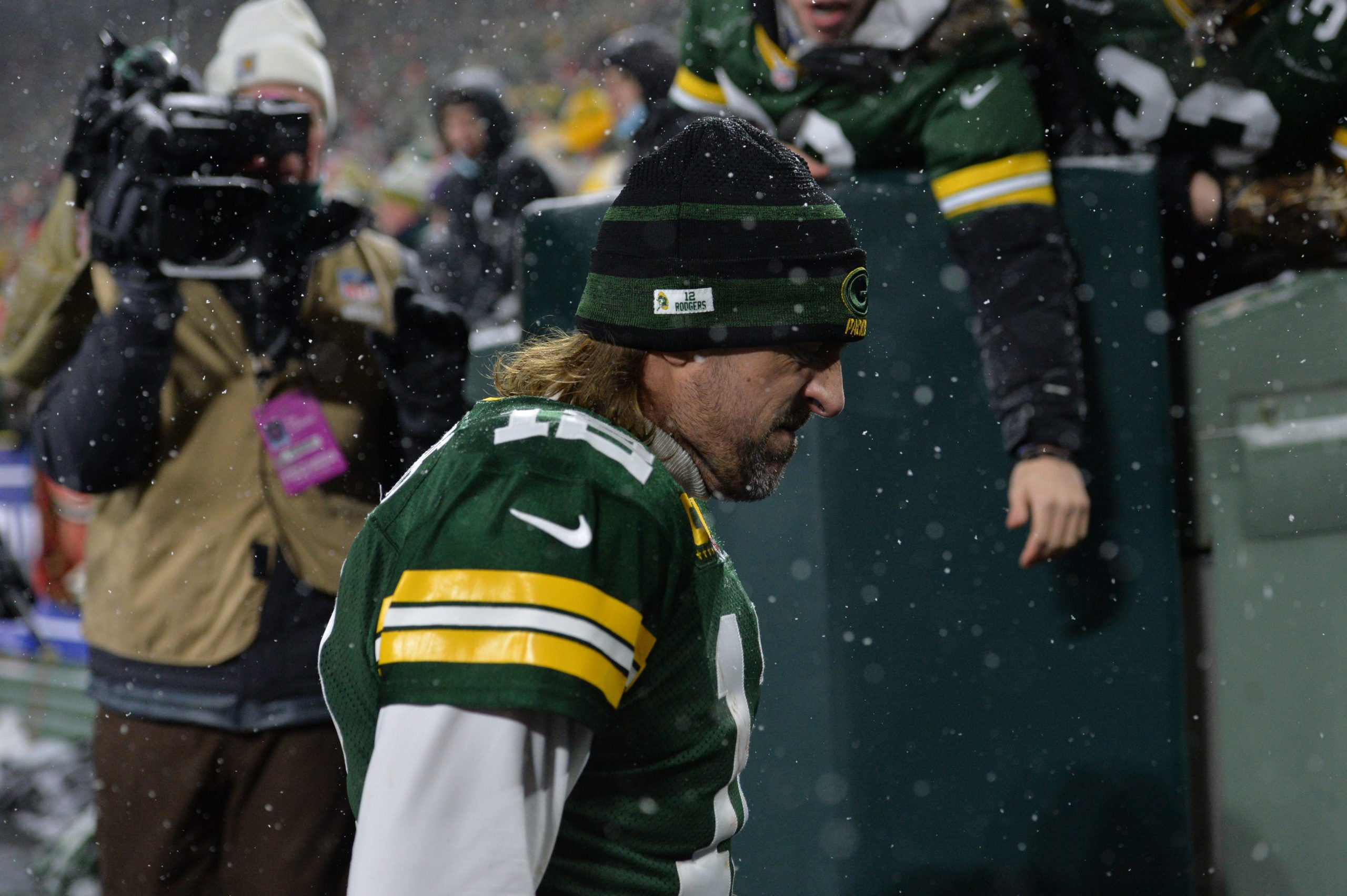 Jan 22, 2022; Green Bay, Wisconsin, USA; Green Bay Packers quarterback Aaron Rodgers (12) walks off the field after a NFC Divisional playoff football game against the San Francisco 49ers at Lambeau Field. Mandatory Credit: Jeffrey Becker-USA TODAY Sports