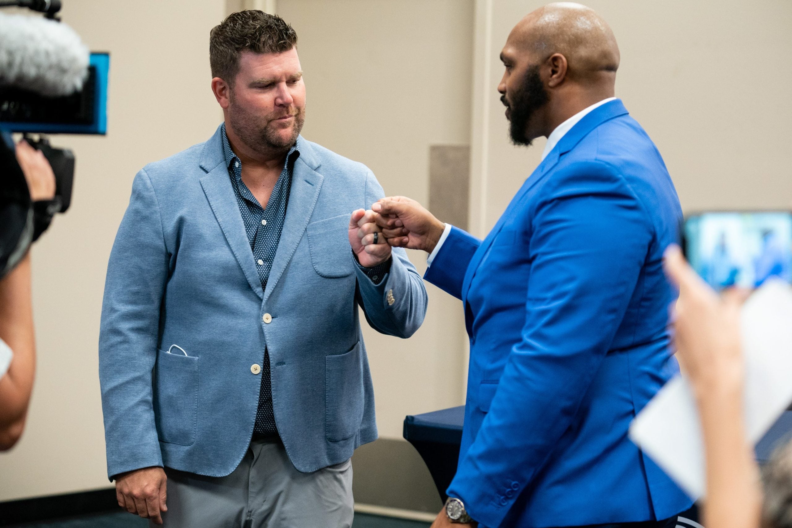 Tennessee Titans general manager Jon Robinson, left, greets former Tennessee Titans defensive tackle Jurrell Casey after Casey announced his retirement during a press conference at Nissan Stadium in Nashville, Tenn., Thursday, Sept. 2, 2021. Jc 090221 An 003