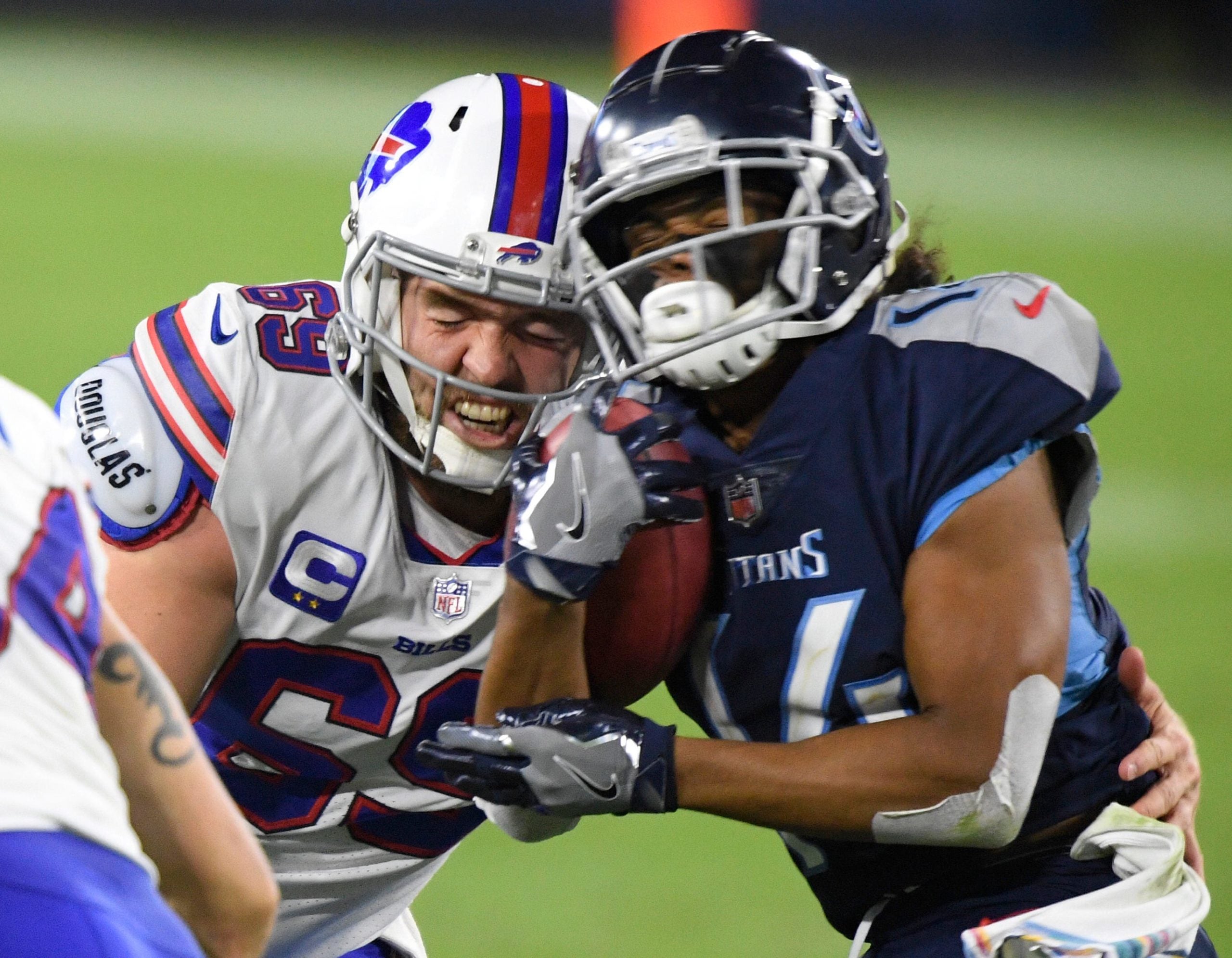 Buffalo Bills long snapper Reid Ferguson (69) hits Tennessee Titans wide receiver Kalif Raymond (14) during the second quarter at Nissan Stadium Tuesday, Oct. 13, 2020 in Nashville, Tenn. An58105