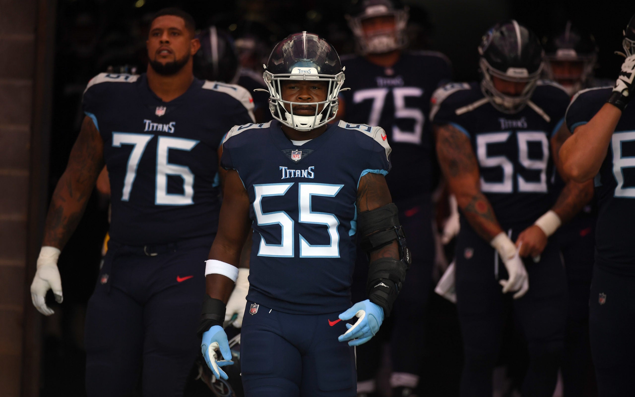 Aug 28, 2021; Nashville, TN, USA; Tennessee Titans inside linebacker Jayon Brown (55) walks to the field before the game against the Chicago Bears at Nissan Stadium. Mandatory Credit: Christopher Hanewinckel-USA TODAY Sports