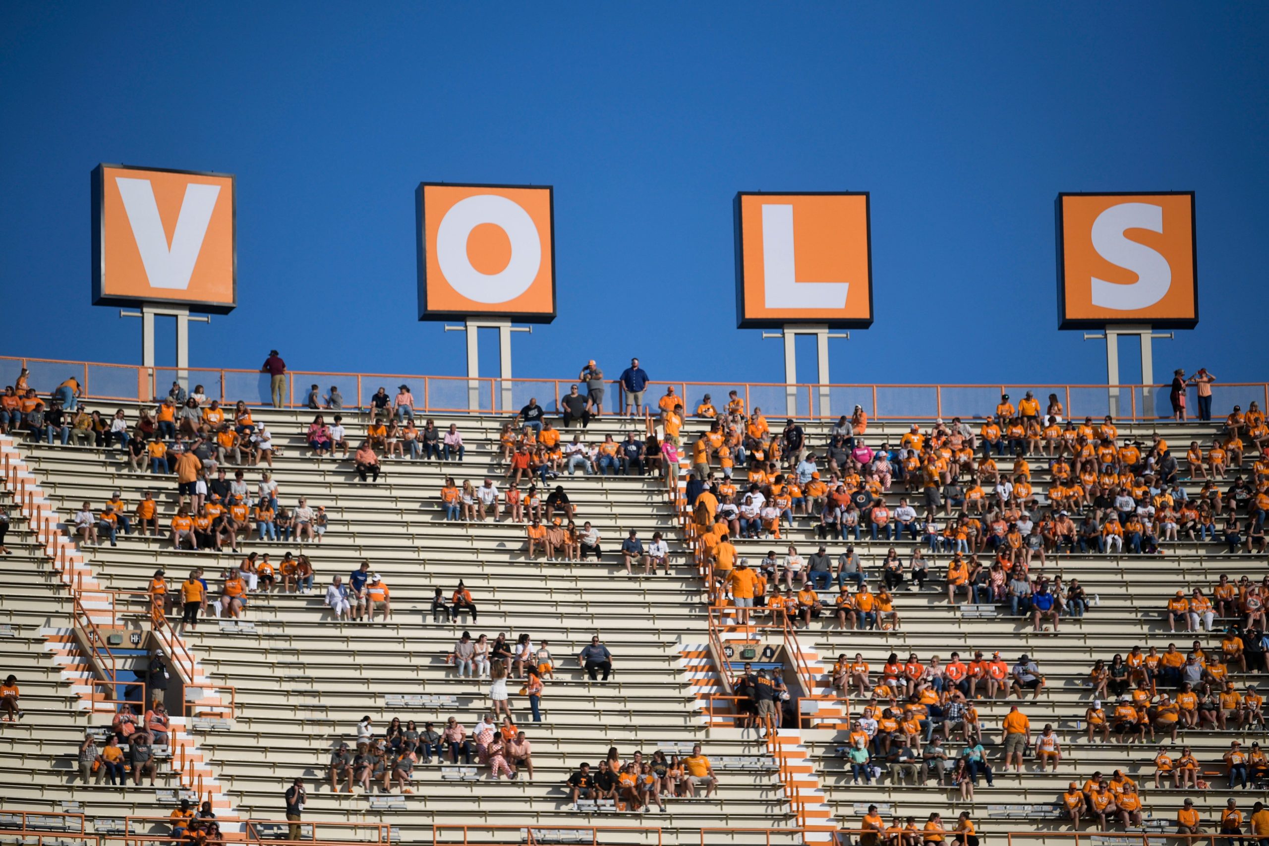 Fans find their seats beneath the newly-installed V-O-L-S letters in the south end zone warm up ahead of a game between Tennessee and Akron at Neyland Stadium in Knoxville, Tenn. on Saturday, Sept. 17, 2022. Kns Utvakron0917