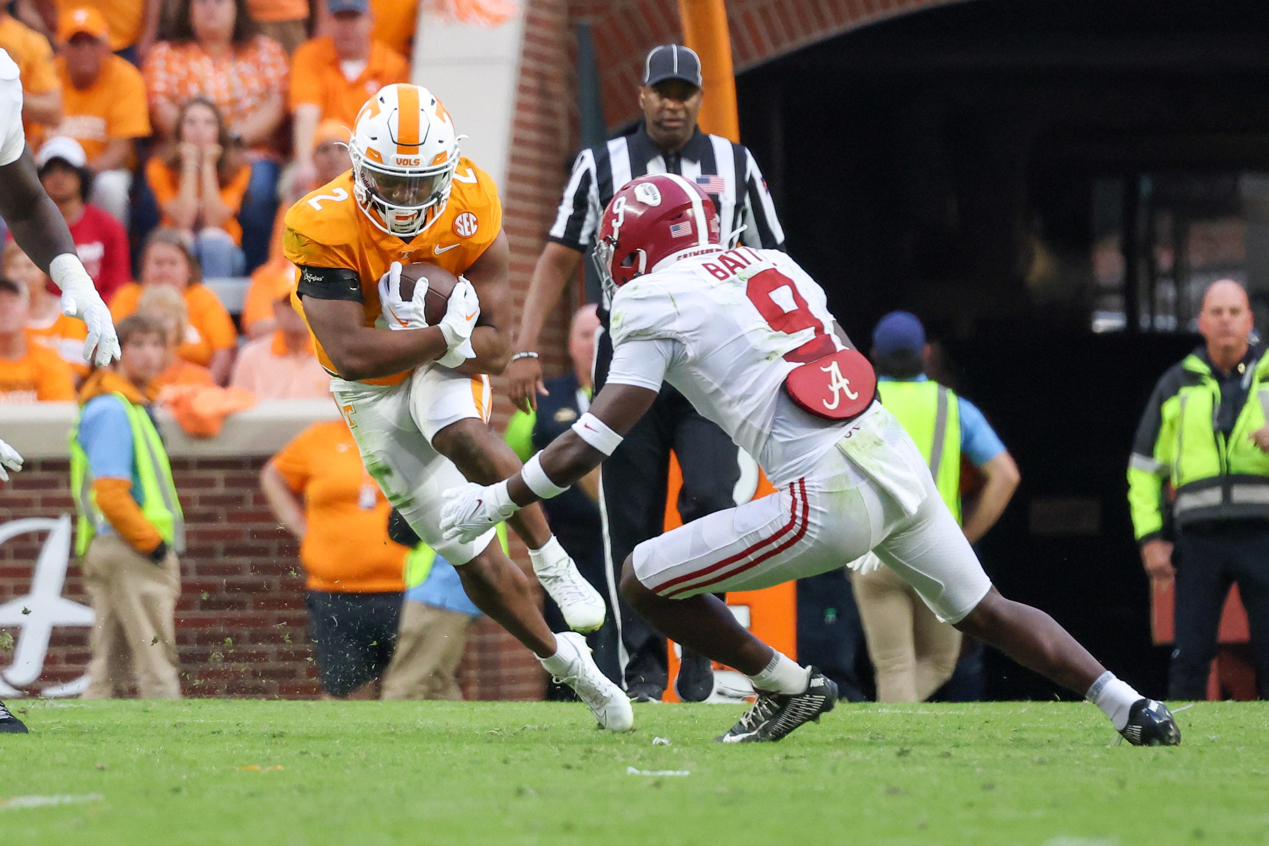Oct 15, 2022; Knoxville, Tennessee, USA; Tennessee Volunteers running back Jabari Small (2) runs the ball against Alabama Crimson Tide defensive back Jordan Battle (9) during the second half at Neyland Stadium. Mandatory Credit: Randy Sartin-USA TODAY Sports