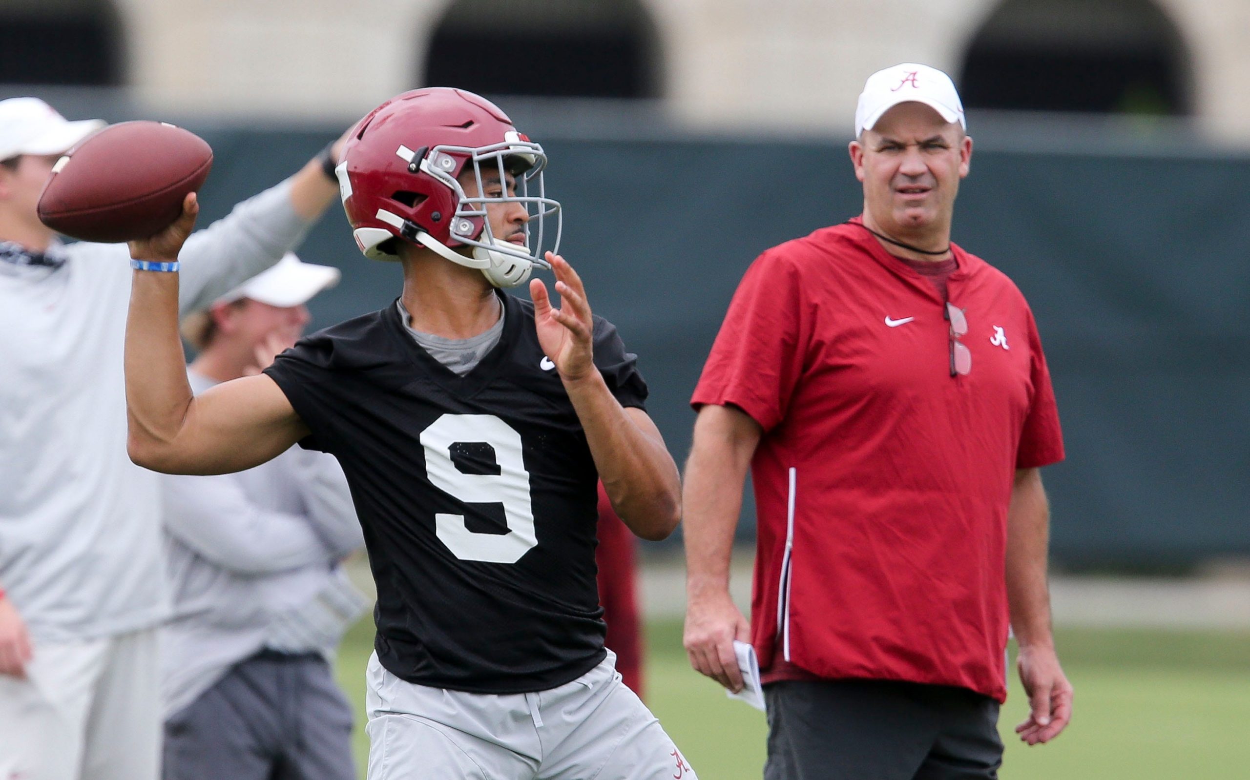 New offensive coordinator Bill O'Brien watches quarterback Bryce Young throw during practice. The Alabama Crimson Tide opened practice for the 2021 season as they prepare to defend the 2020 National Championship Friday, Aug. 6, 2021. [Staff Photo/Gary Cosby Jr.] Alabama First Practice