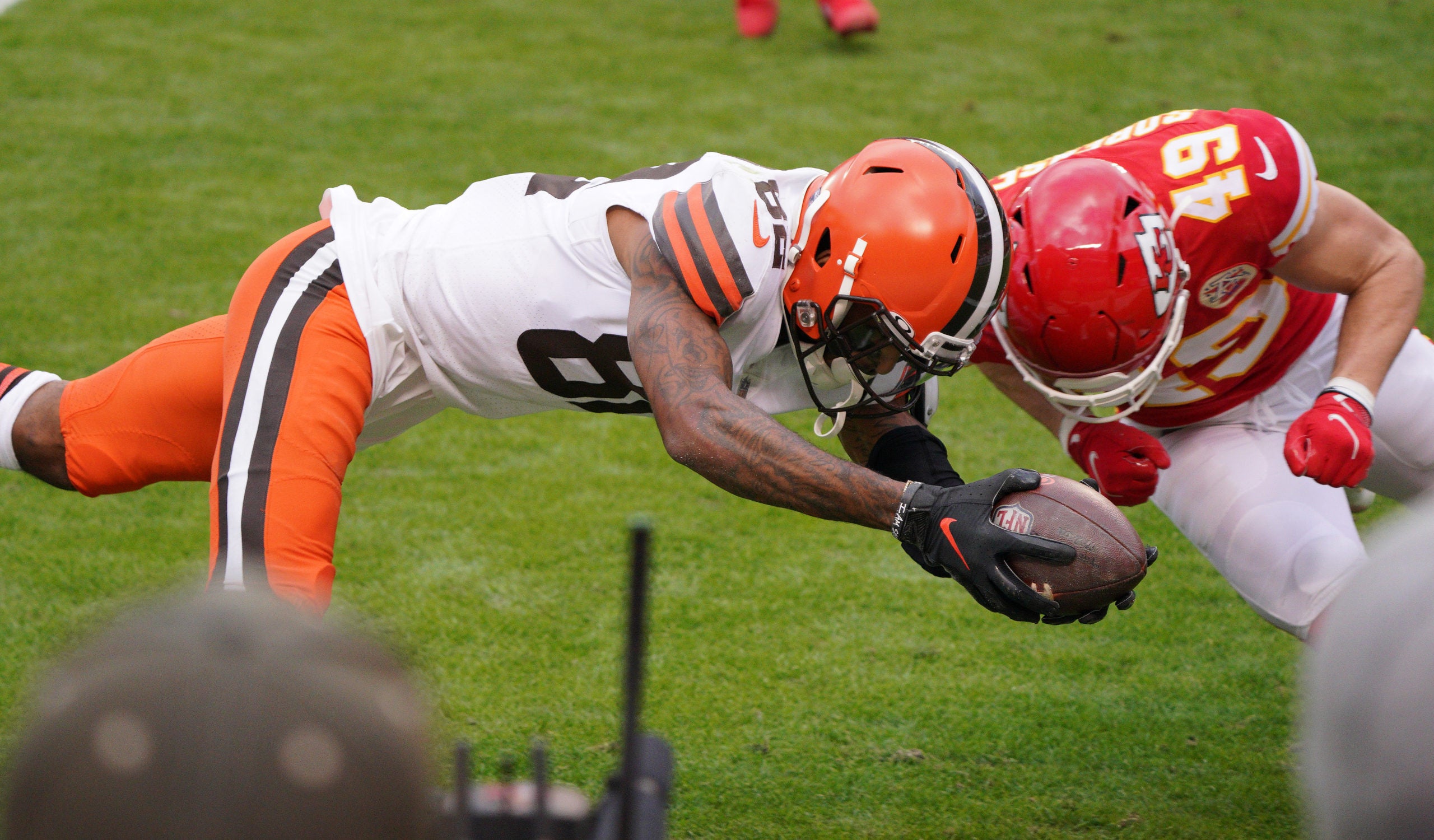 Jan 17, 2021; Kansas City, Missouri, USA; Cleveland Browns wide receiver Rashard Higgins (82) moves the ball on a scoring attempt against Kansas City Chiefs free safety Daniel Sorensen (49) during the first half in the AFC Divisional Round playoff game at Arrowhead Stadium. Mandatory Credit: Denny Medley-USA TODAY Sports