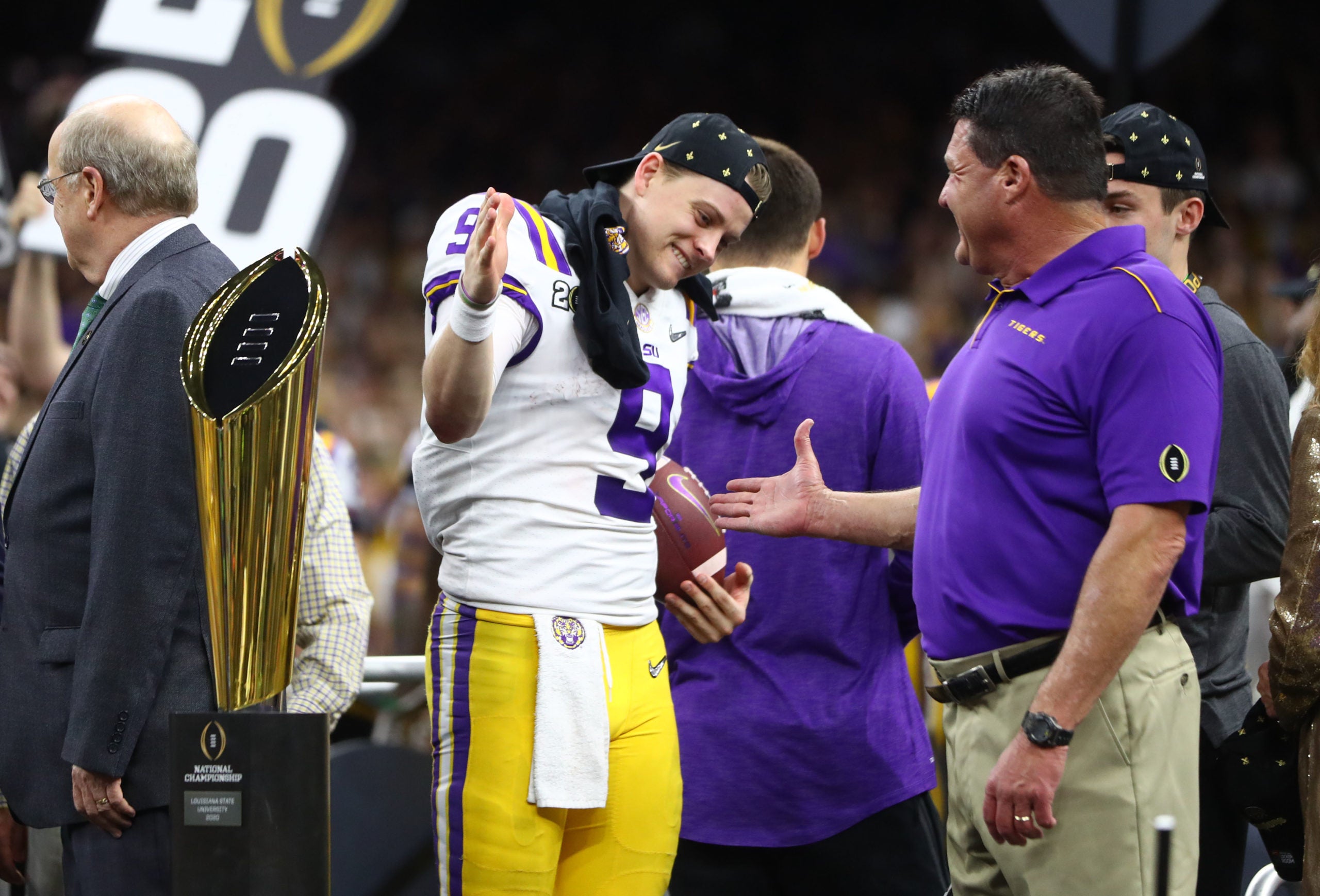 Jan 13, 2020; New Orleans, Louisiana, USA; LSU Tigers head coach Ed Orgeron celebrates with quarterback Joe Burrow (9) after defeating the Clemson Tigers in the College Football Playoff national championship game at Mercedes-Benz Superdome. Mandatory Credit: Mark J. Rebilas-USA TODAY Sports