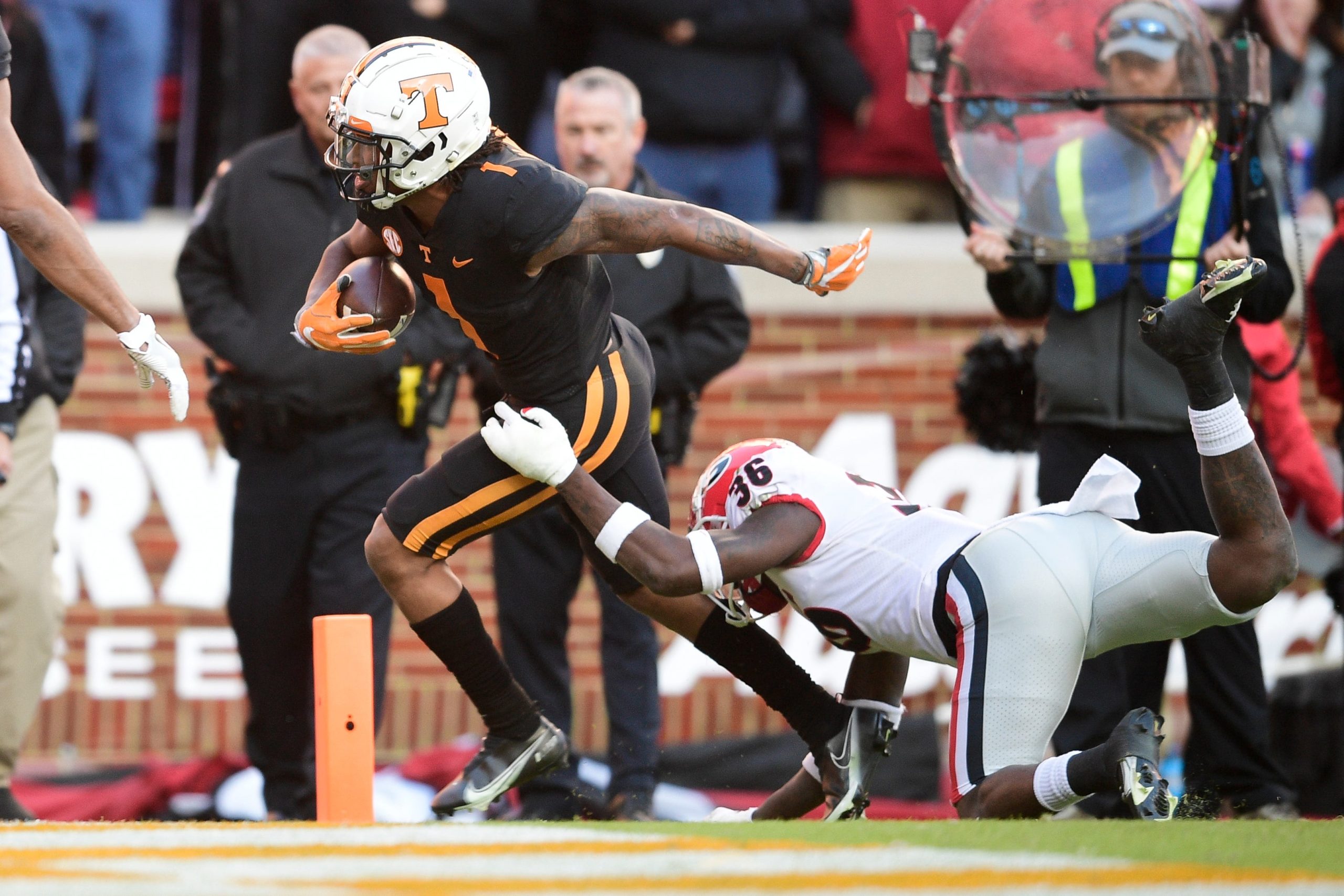 Tennessee wide receiver Velus Jones Jr. (1) runs into the end zone for a touchdown while tackled by Georgia defensive back Latavious Brini (36) during an SEC football homecoming game between the Tennessee Volunteers and the Georgia Bulldogs in Neyland Stadium in Knoxville on Saturday, Nov. 13, 2021. Tennesseegeorgia1113 1395