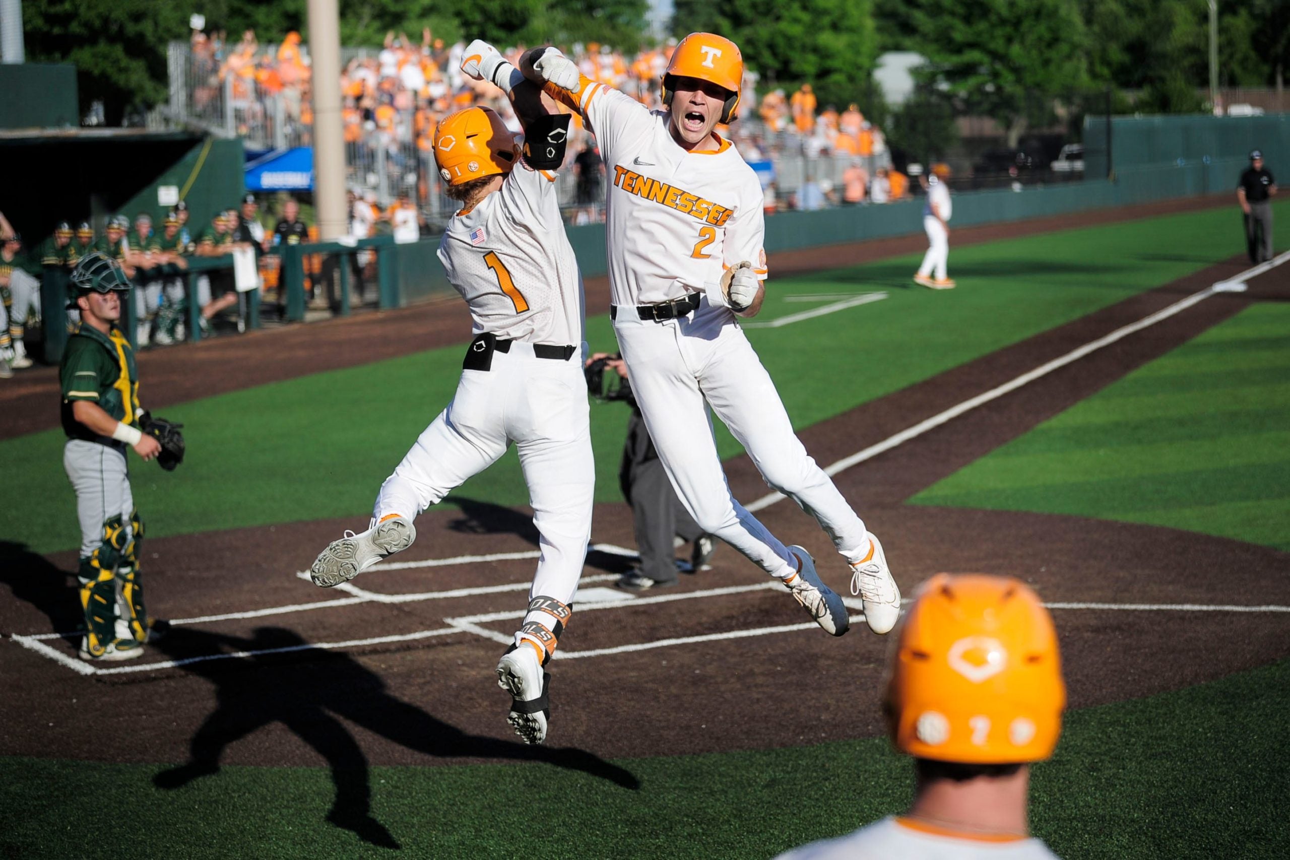 Tennessee's Max Ferguson (2) celebrates a home run hit with Tennessee's Drew Gilbert (1) at the NCAA Baseball Tournament Knoxville Regional at Lindsey Nelson Stadium in Knoxville, Tenn. on Friday, June 4, 2021. Kns Vols Regional Opener