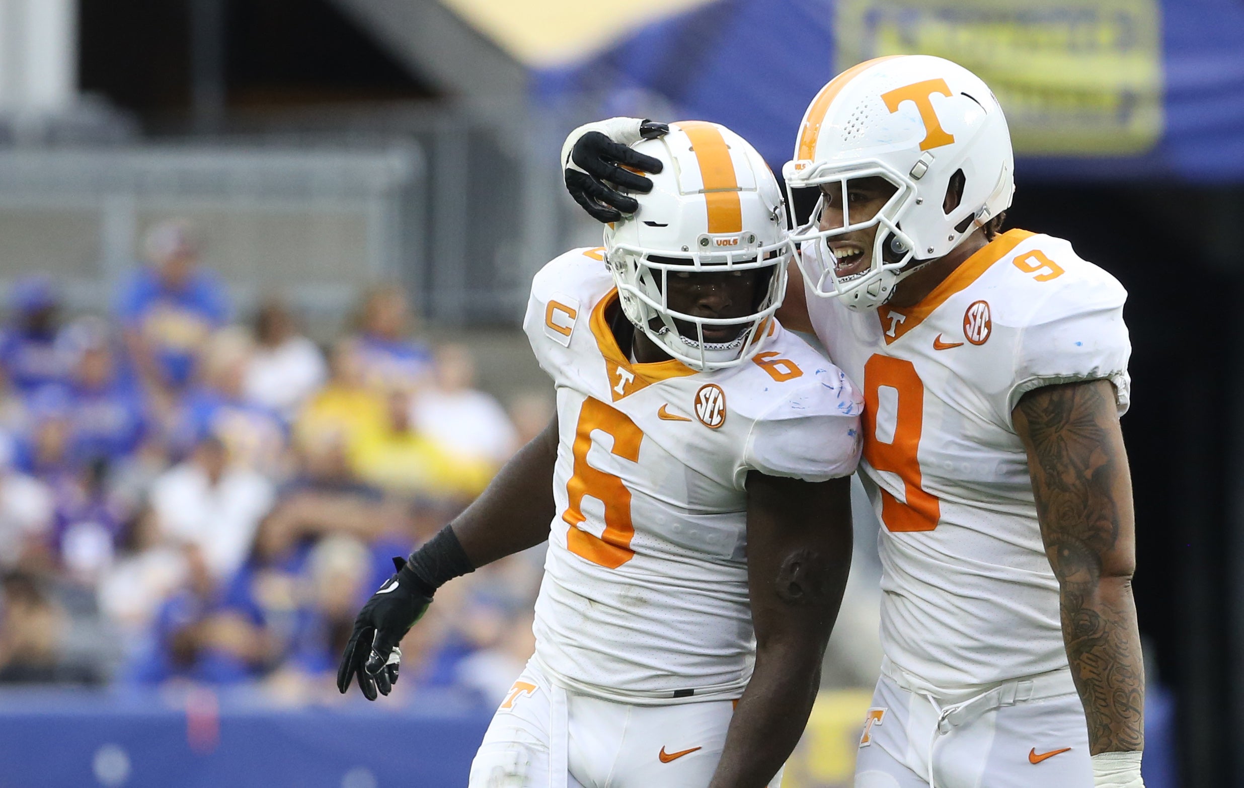 Sep 10, 2022; Pittsburgh, Pennsylvania, USA;  Tennessee Volunteers defensive linemen Byron Young (6) and Tyler Baron (9) celebrate a defensive stop against the Pittsburgh Panthers during the fourth quarter at Acrisure Stadium.  Tennessee won 34-27 in overtime. Mandatory Credit: Charles LeClaire-USA TODAY Sports