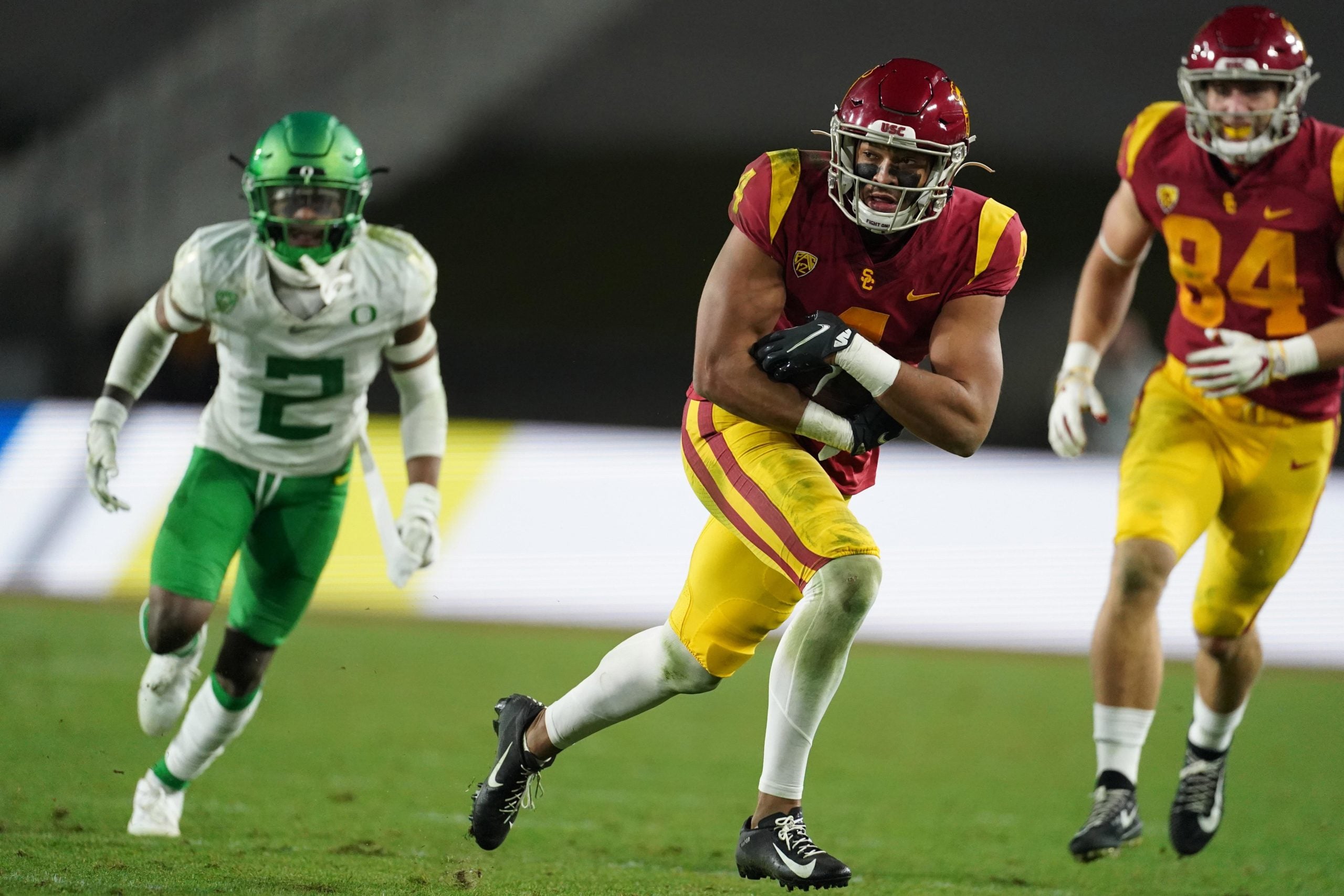Dec 18, 2020; Los Angeles, California, USA; Southern California Trojans wide receiver Bru McCoy (4) carries the ball against the Oregon Ducks  during the Pac-12 Championship at United Airlines Field at Los Angeles Memorial Coliseum. Oregon defeated USC 31-24. Mandatory Credit: Kirby Lee-USA TODAY Sports