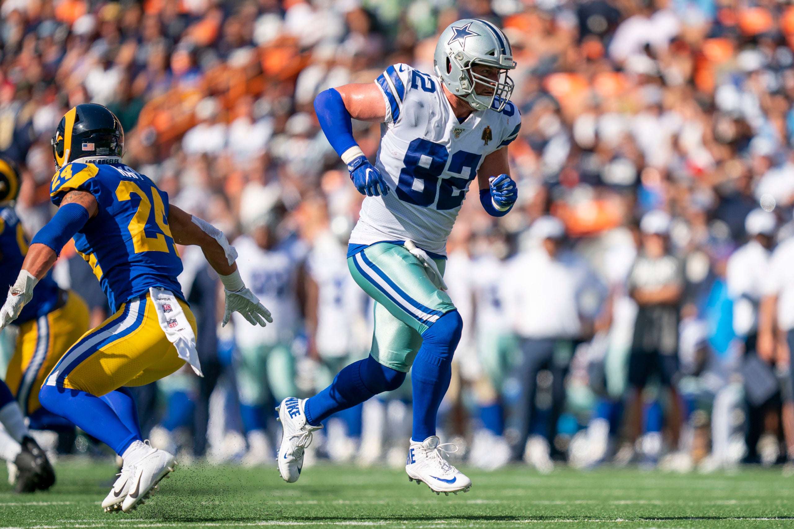 August 17, 2019;  Honolulu, HI, USA; Dallas Cowboys tight end Jason Witten (82) runs a route against Los Angeles Rams safety Taylor Rapp (24) during the first quarter at Aloha Stadium. Mandatory Credit: Kyle Terada-USA TODAY Sports