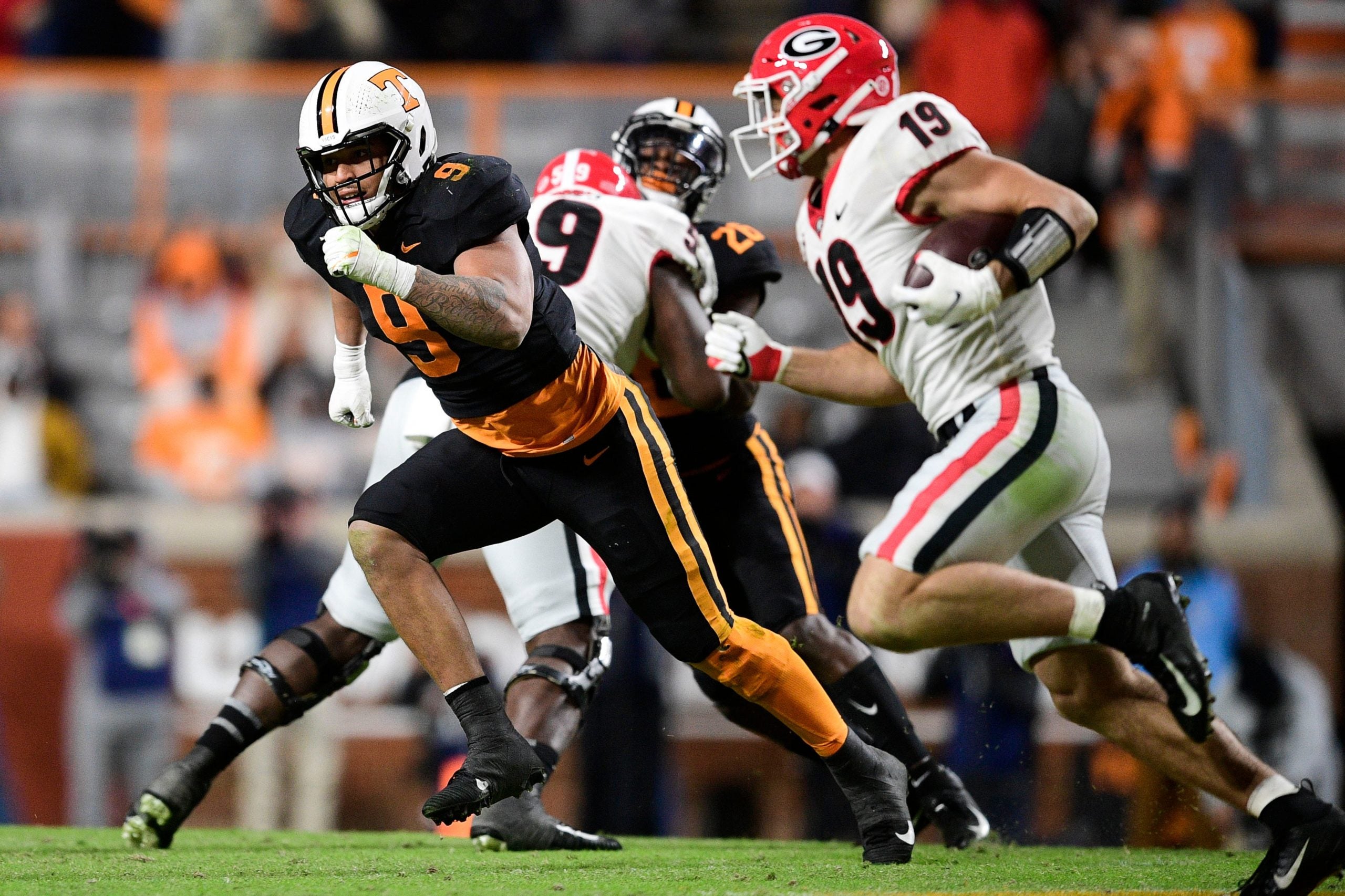 Tennessee defensive lineman/linebacker Tyler Baron (9) defends against Georgia tight end Brock Bowers (19) during an SEC football game between Tennessee and Georgia at Neyland Stadium in Knoxville, Tenn. on Saturday, Nov. 13, 2021. Kns Tennessee Georgia Football
