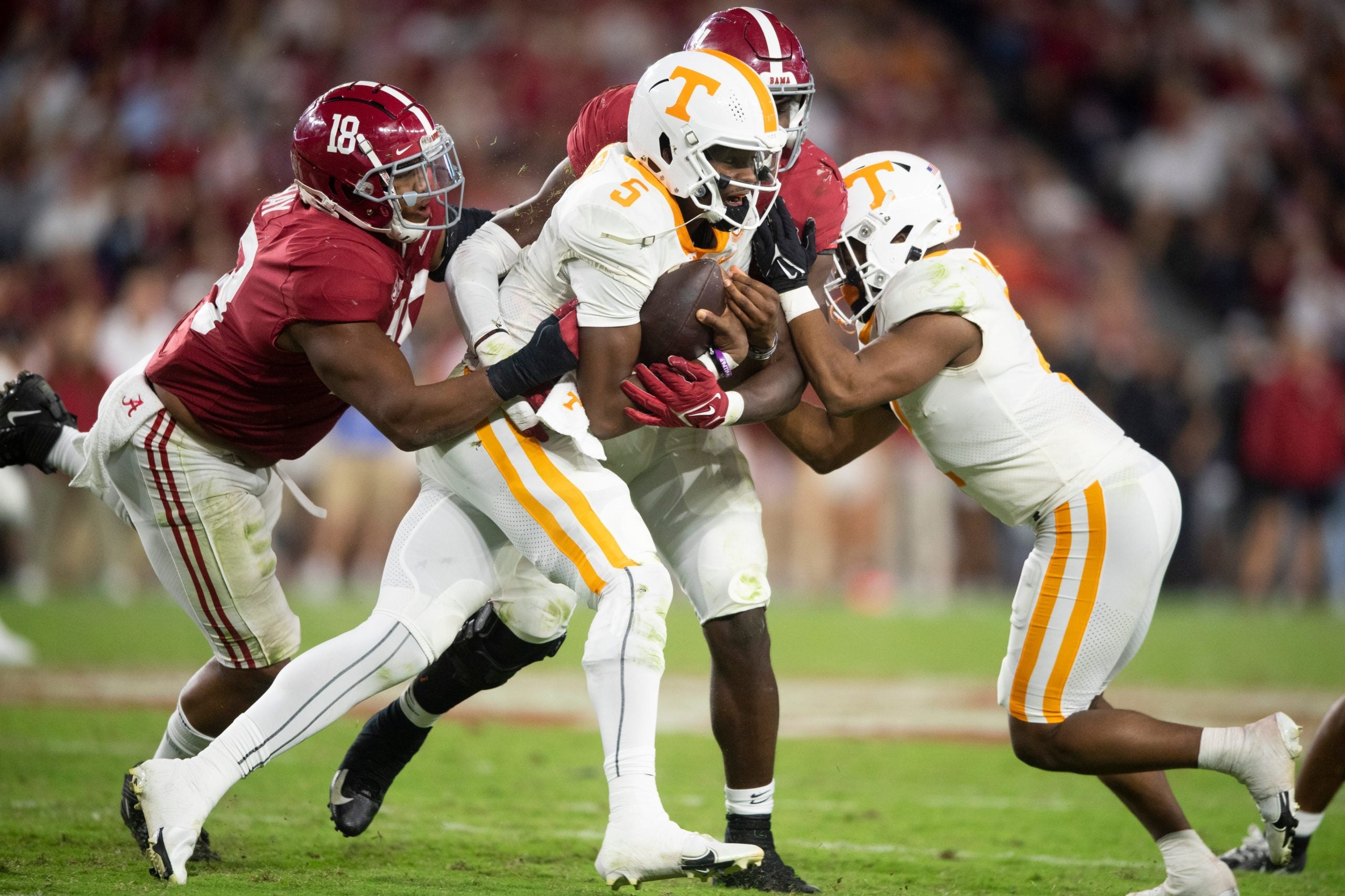 Tennessee quarterback Hendon Hooker (5) tries to avoid tackles during a football game between the Tennessee Volunteers and the Alabama Crimson Tide at Bryant-Denny Stadium in Tuscaloosa, Ala., on Saturday, Oct. 23, 2021. Kns Tennessee Alabama Football Bp