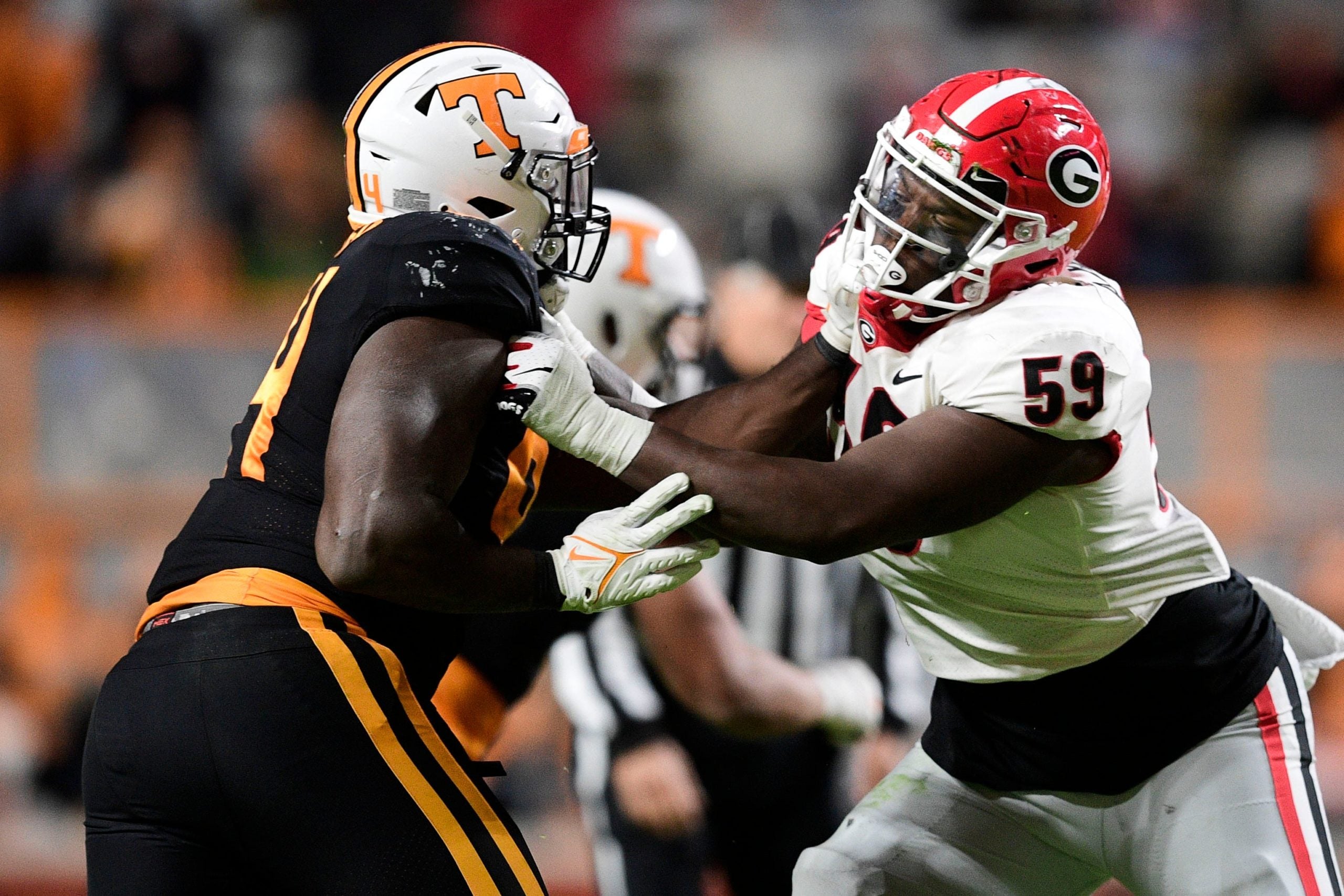 Tennessee defensive lineman Matthew Butler (94) and Georgia offensive lineman Broderick Jones (59) push one another during an SEC football game between Tennessee and Georgia at Neyland Stadium in Knoxville, Tenn. on Saturday, Nov. 13, 2021. Kns Tennessee Georgia Football