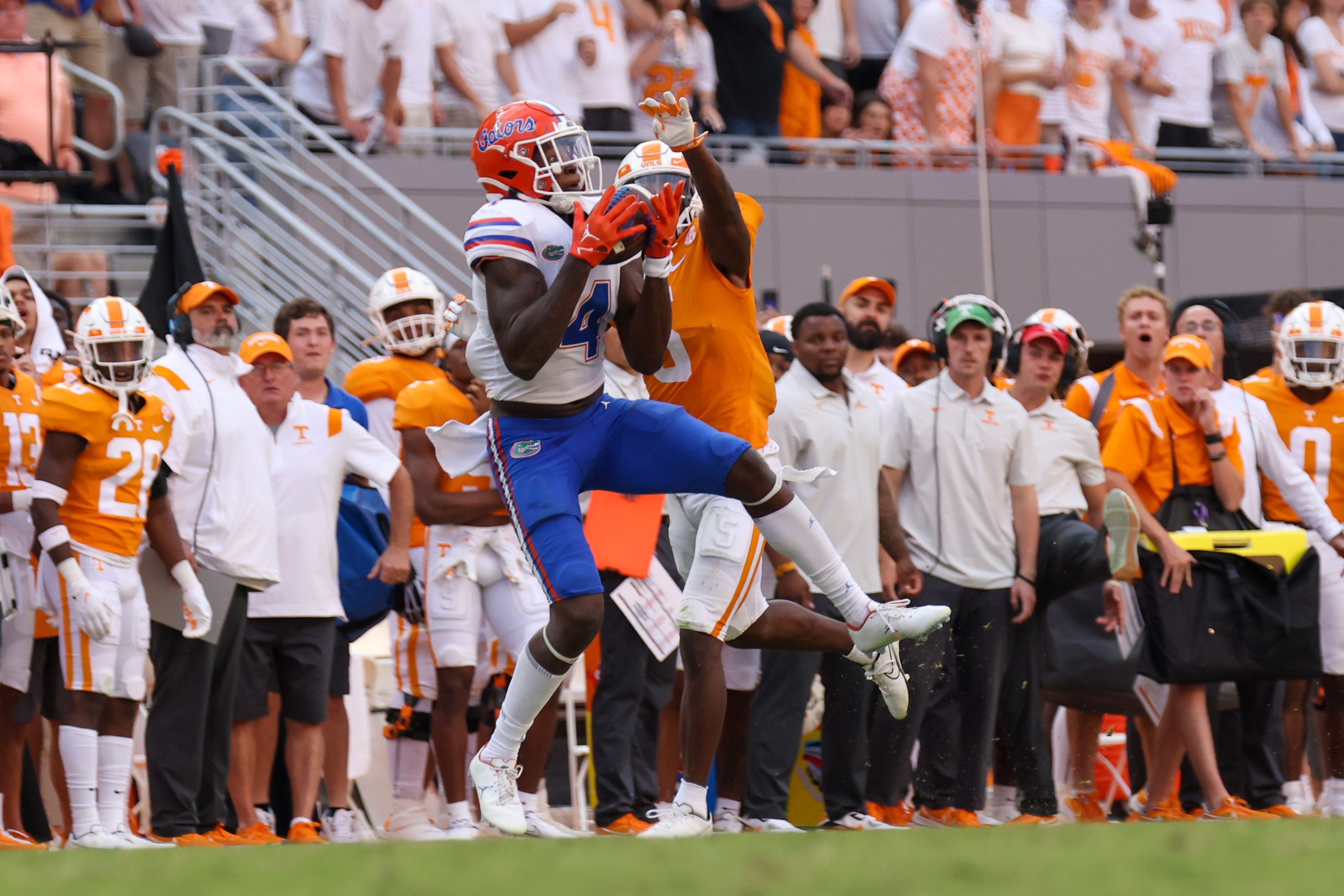 Sep 24, 2022; Knoxville, Tennessee, USA; Florida Gators wide receiver Justin Shorter (4) catches a pass against Tennessee Volunteers defensive back Kamal Hadden (5) during the second half at Neyland Stadium. Mandatory Credit: Randy Sartin-USA TODAY Sports