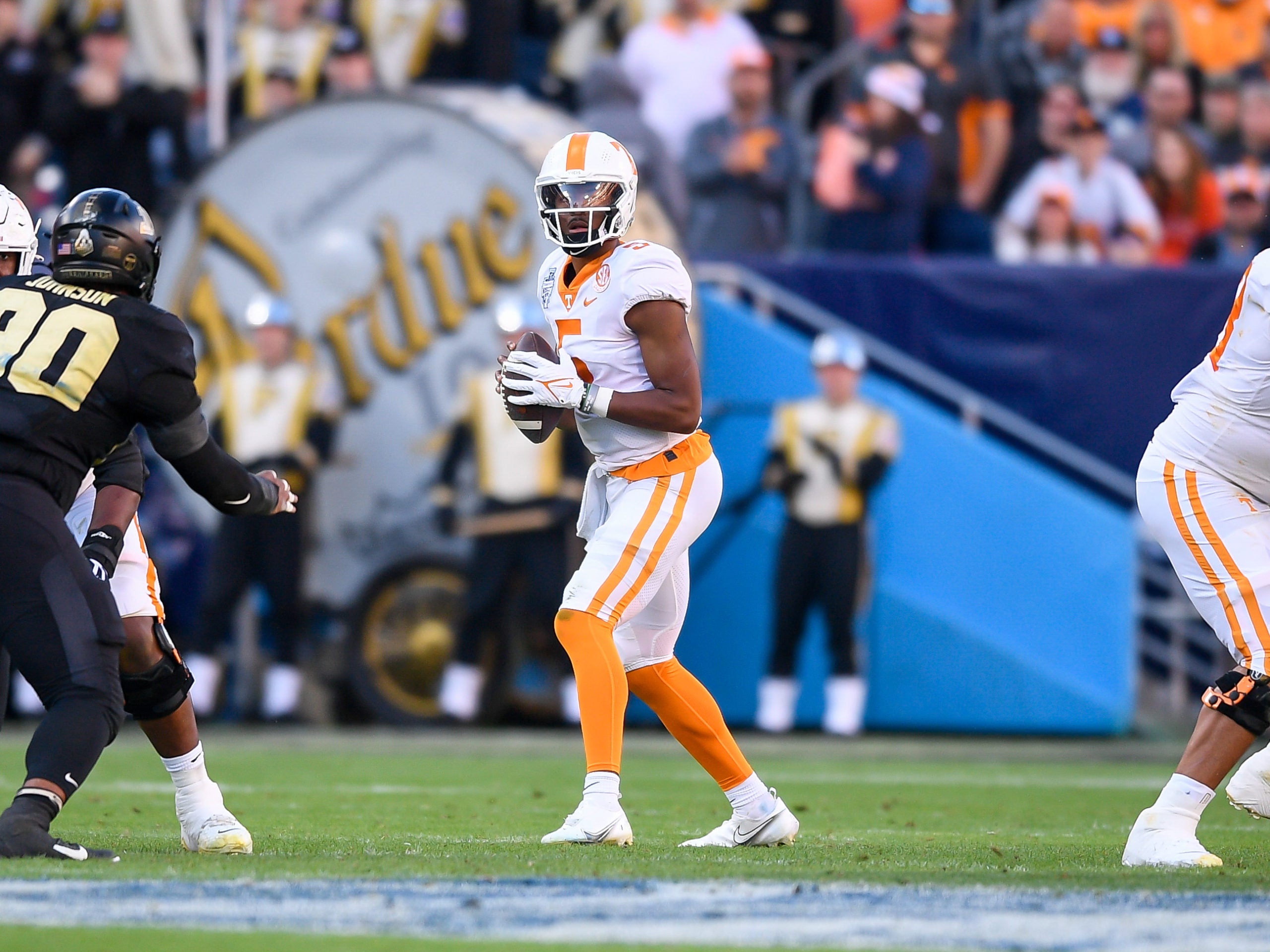 Dec 30, 2021; Nashville, TN, USA;  Tennessee Volunteers quarterback Hendon Hooker (5) against the Purdue Boilermakers during the first half at Nissan Stadium. Mandatory Credit: Steve Roberts-USA TODAY Sports