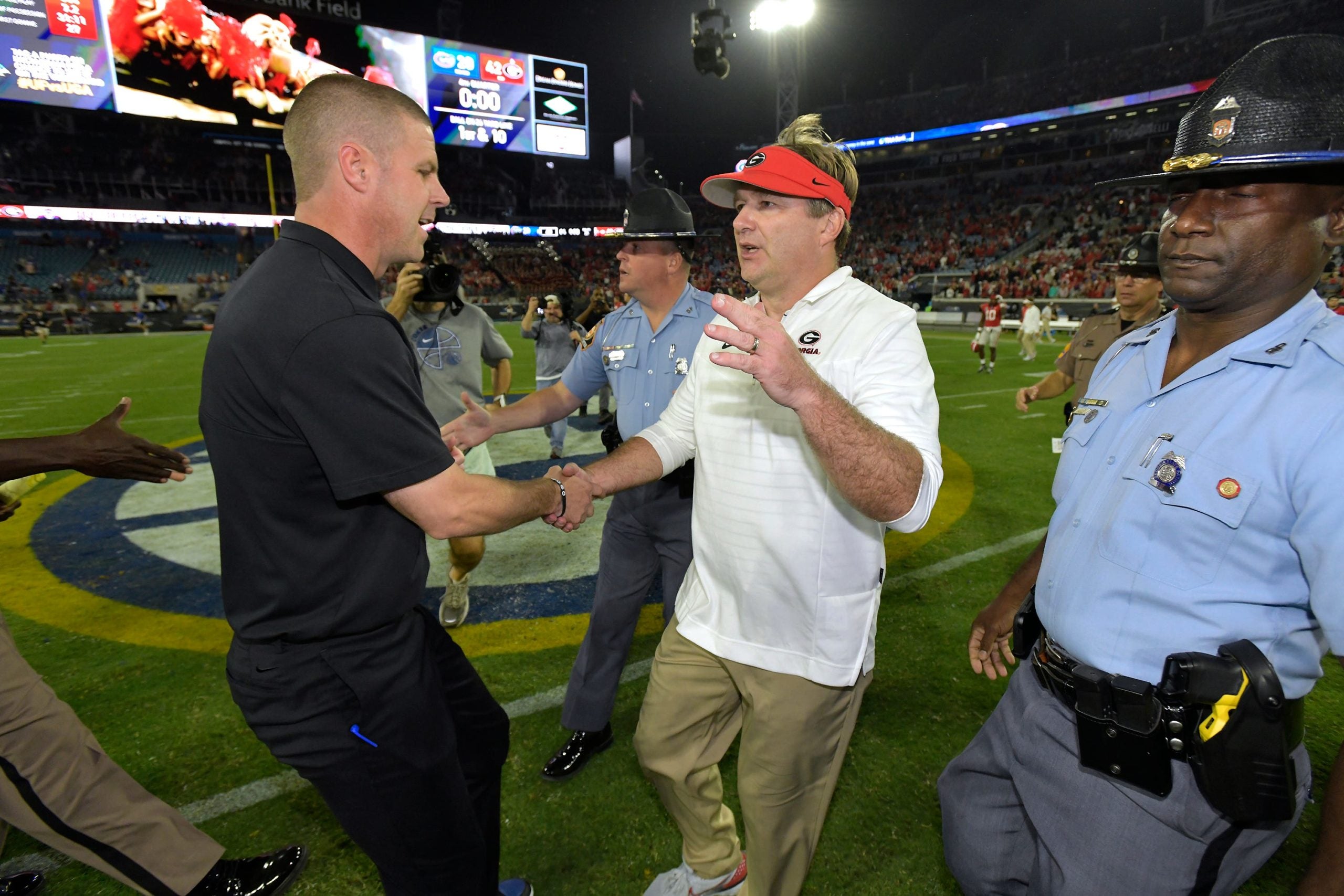 Florida Gators head coach Billy Napier and Georgia Bulldogs head coach Kirby Smart shake hands midfield at the end of the Bulldog's victory over the Gators. The annual Georgia vs Florida football rivalry was held at TIAA Bank Field in Jacksonville, FL Saturday, October 29, 2022. The Bulldogs went in at halftime with a 28 to 3 lead over the Gators and won with a final score of 42 to 20. [Bob Self/Florida Times-Union] Jki 102822 Bs Georgia Vs Florida Football Game 2nd Half 08