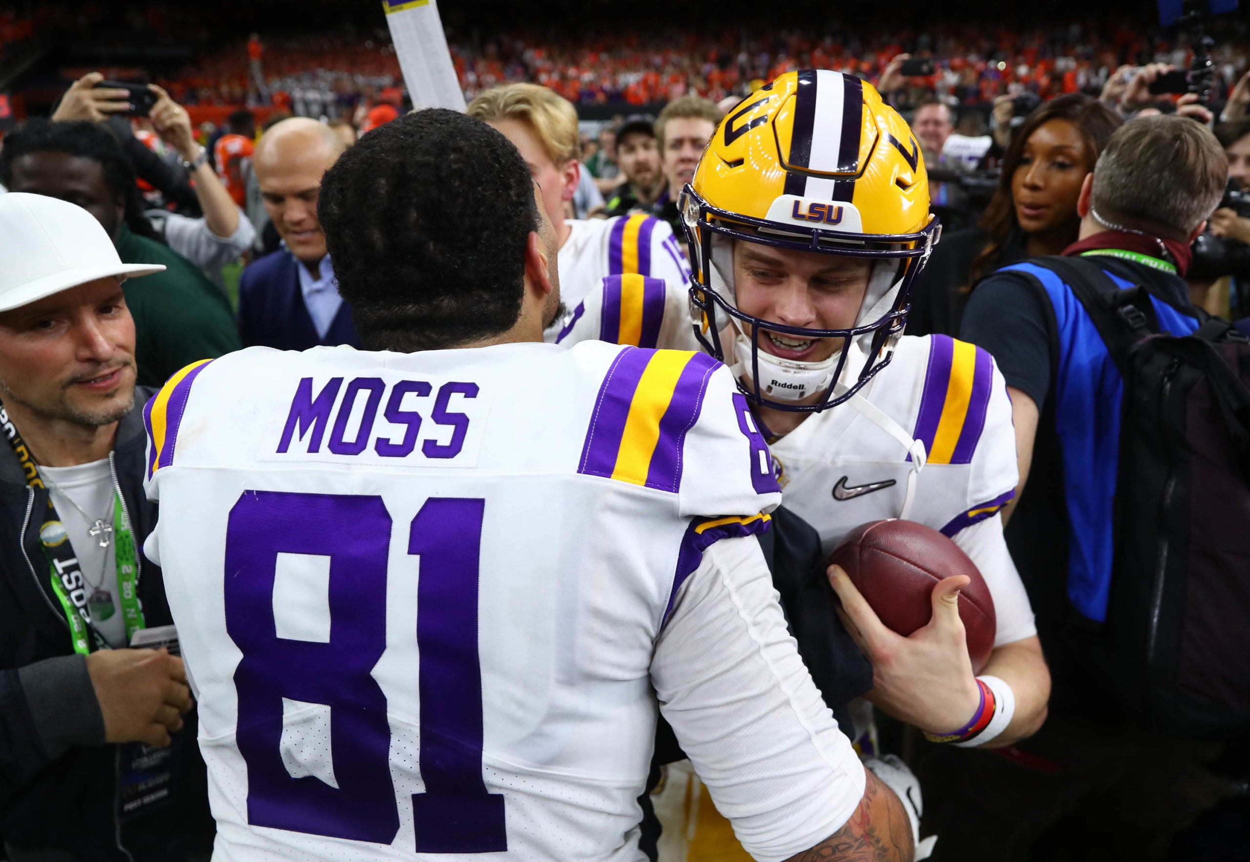 Jan 13, 2020; New Orleans, Louisiana, USA; LSU Tigers quarterback Joe Burrow (9) celebrates with tight end Thaddeus Moss (81) after defeating the Clemson Tigers in the College Football Playoff national championship game at Mercedes-Benz Superdome. Mandatory Credit: Mark J. Rebilas-USA TODAY Sports