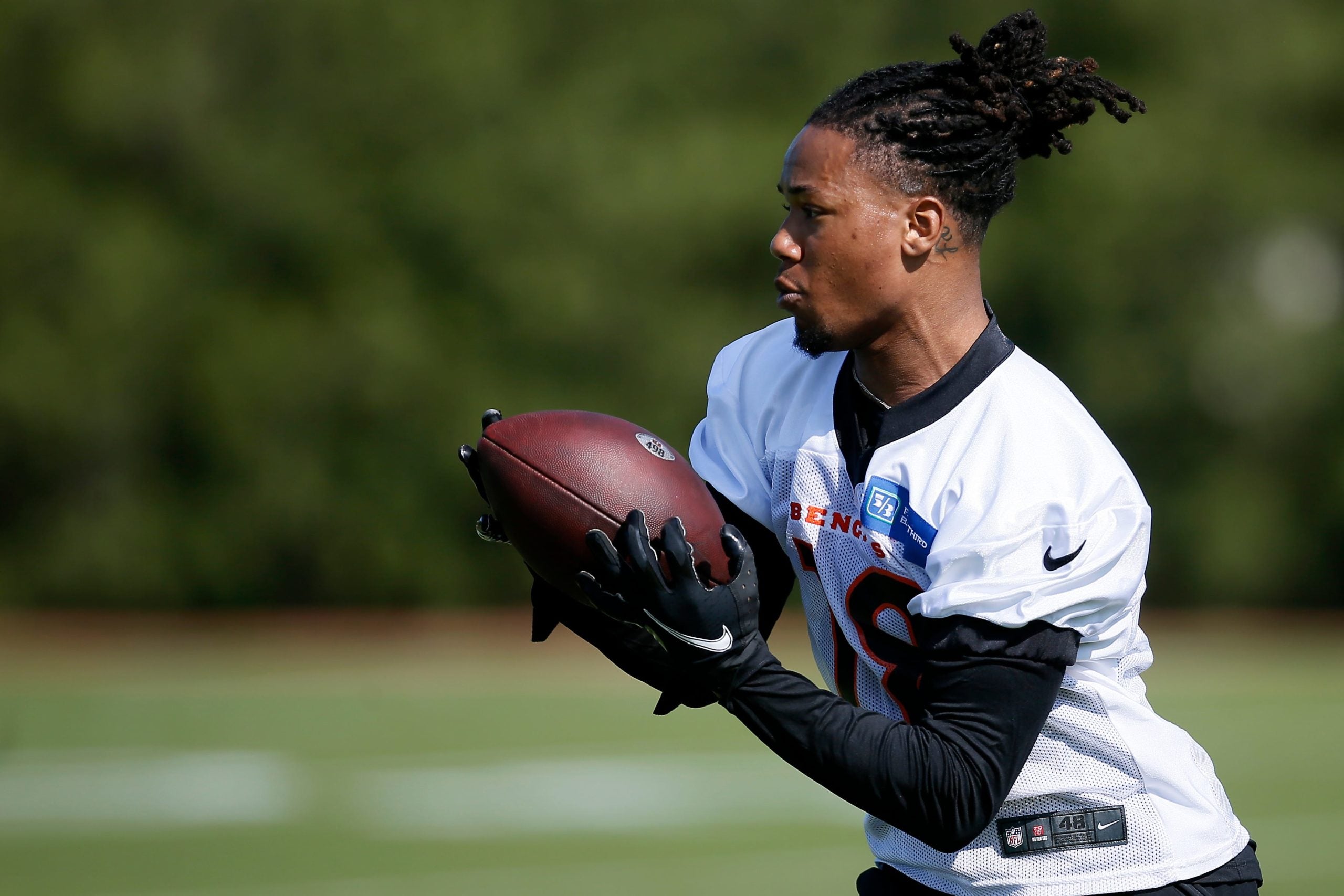 Wide receiver Kwamie Lassiter II (18) catches a pass during the first day of Cincinnati Bengals rookie camp at the Paul Brown Stadium practice field in downtown Cincinnati on Friday, May 13, 2022. Cincinnati Bengals Rookie Camp