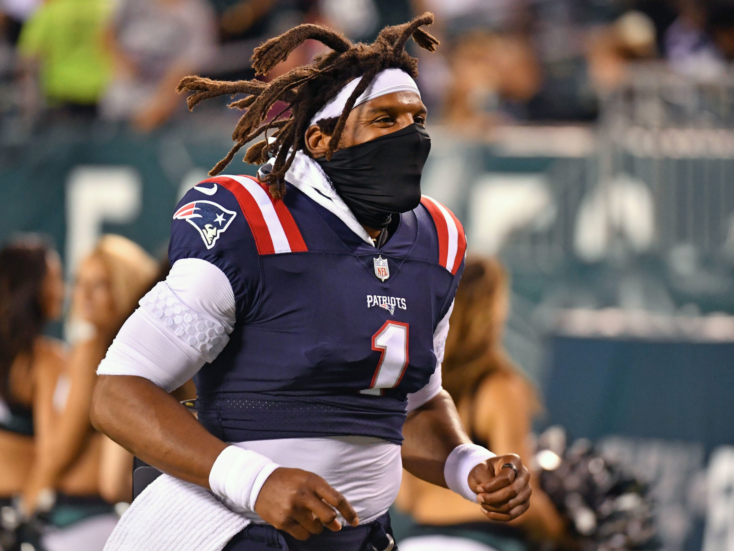 Aug 19, 2021; Philadelphia, Pennsylvania, USA; New England Patriots quarterback Cam Newton (1) runs off the field against the Philadelphia Eagles at Lincoln Financial Field. Mandatory Credit: Eric Hartline-USA TODAY Sports