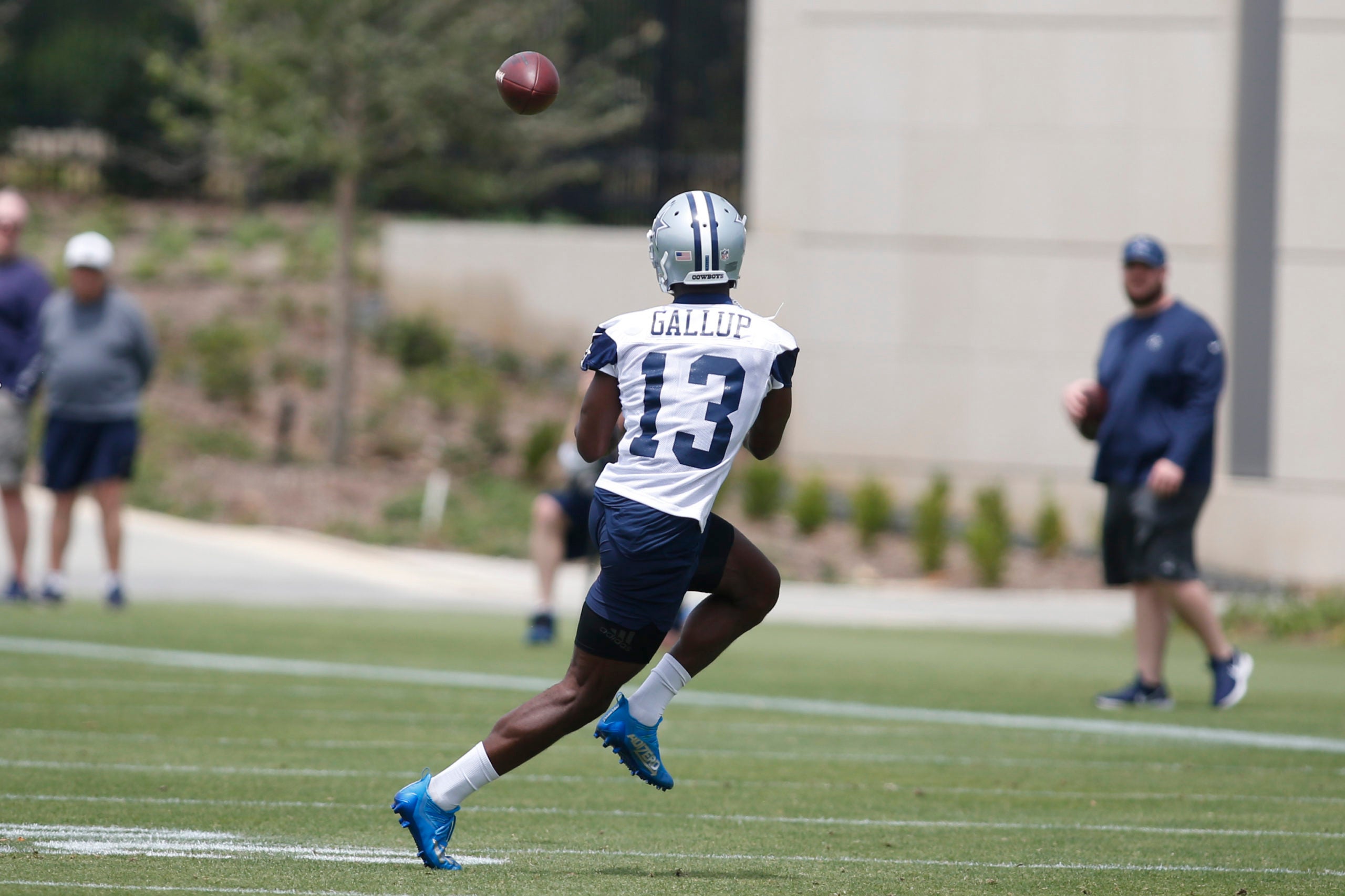 Jun 3, 2021; Frisco, TX, USA; Dallas Cowboys wide receiver Michael Gallup (13) catches a pass during voluntary Organized Team Activities at the Star Training Facility in Frisco, Texas. Mandatory Credit: Tim Heitman-USA TODAY Sports