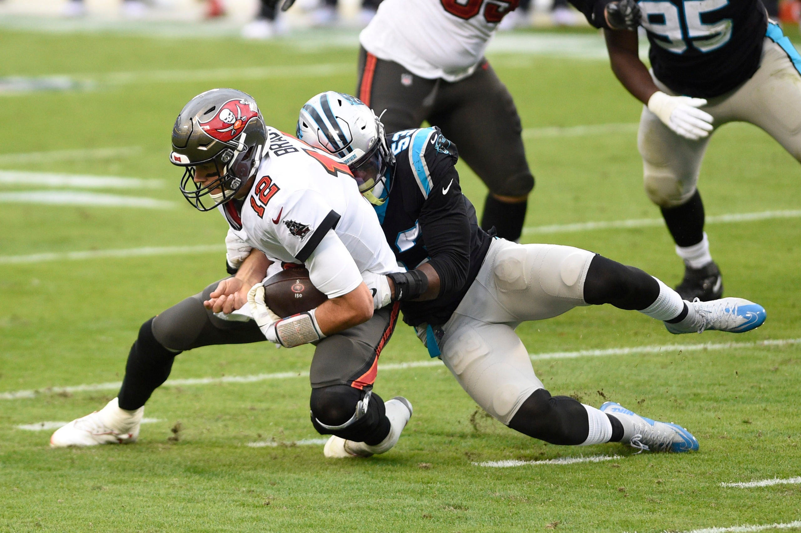 Nov 15, 2020; Charlotte, North Carolina, USA; Tampa Bay Buccaneers quarterback Tom Brady (12) is sacked by Carolina Panthers defensive end Brian Burns (53) in the third quarter at Bank of America Stadium. Mandatory Credit: Bob Donnan-USA TODAY Sports