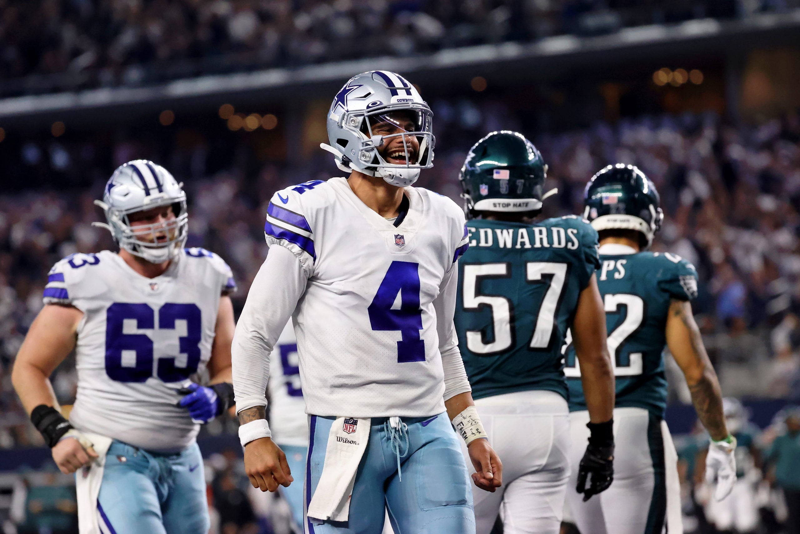 Sep 27, 2021; Arlington, Texas, USA; Dallas Cowboys quarterback Dak Prescott (4) celebrates after making a touchdown pass to tight end Dalton Schultz (not pictured) against the Philadelphia Eagles during the fourth quarter at AT&T Stadium. Mandatory Credit: Kevin Jairaj-USA TODAY Sports