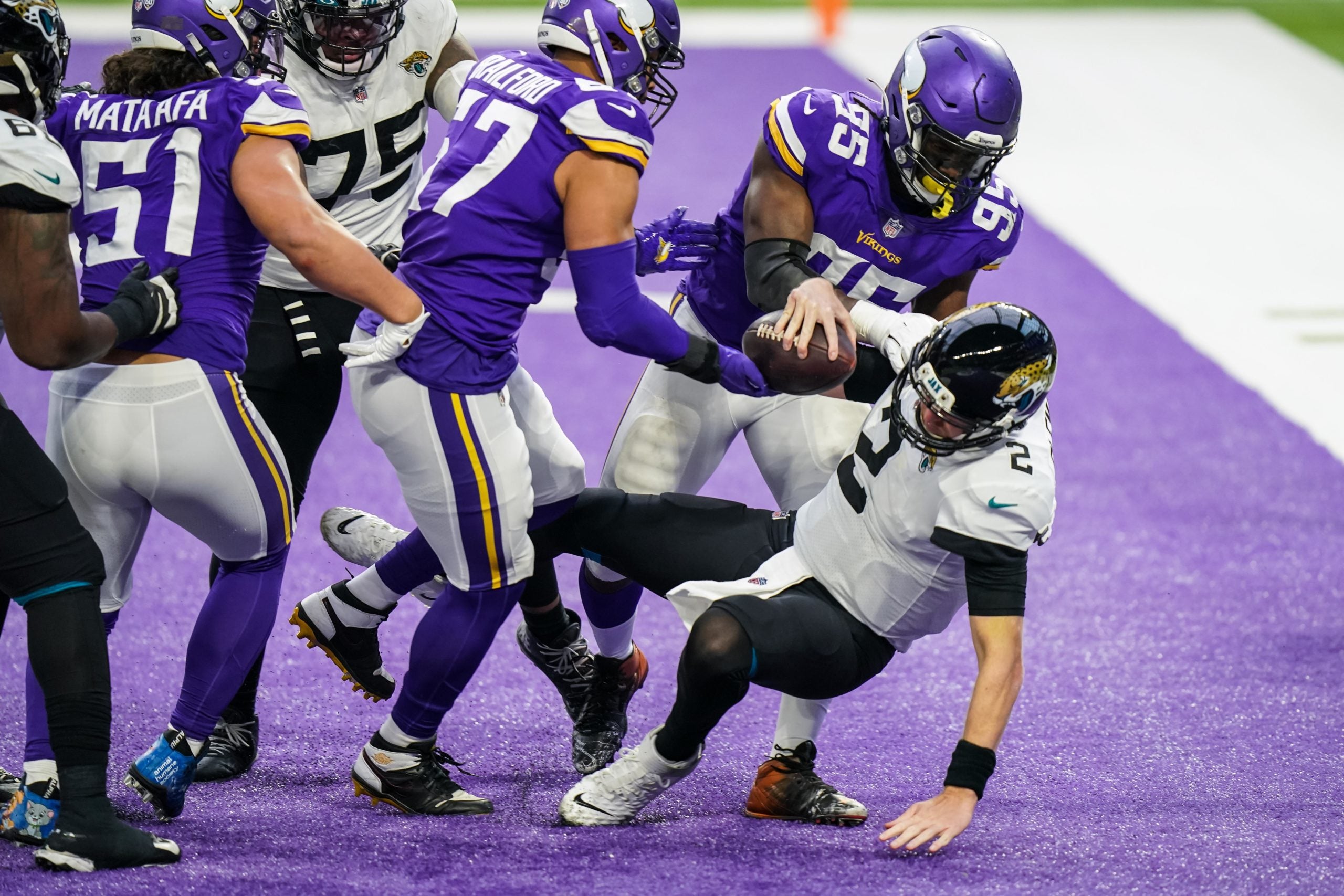 Dec 6, 2020; Minneapolis, Minnesota, USA; Jacksonville Jaguars quarterback Mike Glennon (2) is sacked for a safety by Minnesota Vikings defensive end Ifeadi Odenigbo  (95) during the fourth quarter at U.S. Bank Stadium. Mandatory Credit: Brace Hemmelgarn-USA TODAY Sports