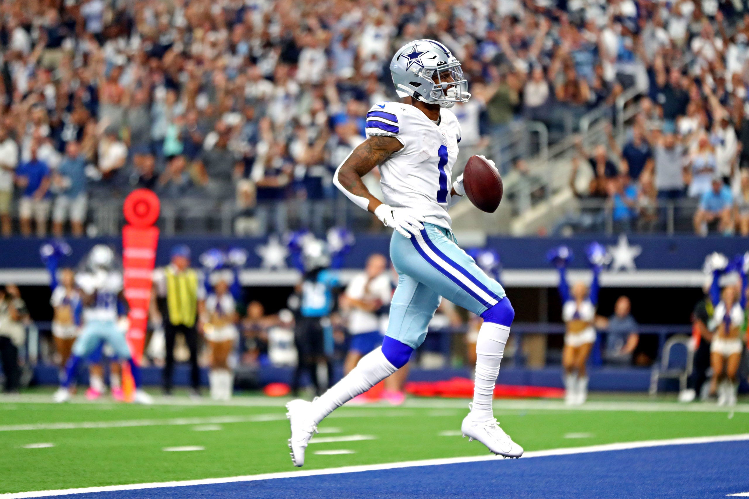 Oct 3, 2021; Arlington, Texas, USA; Dallas Cowboys wide receiver Ced Wilson (1) scores a touchdown during the third quarter against the Carolina Panthers at AT&T Stadium. Mandatory Credit: Mark J. Rebilas-USA TODAY Sports