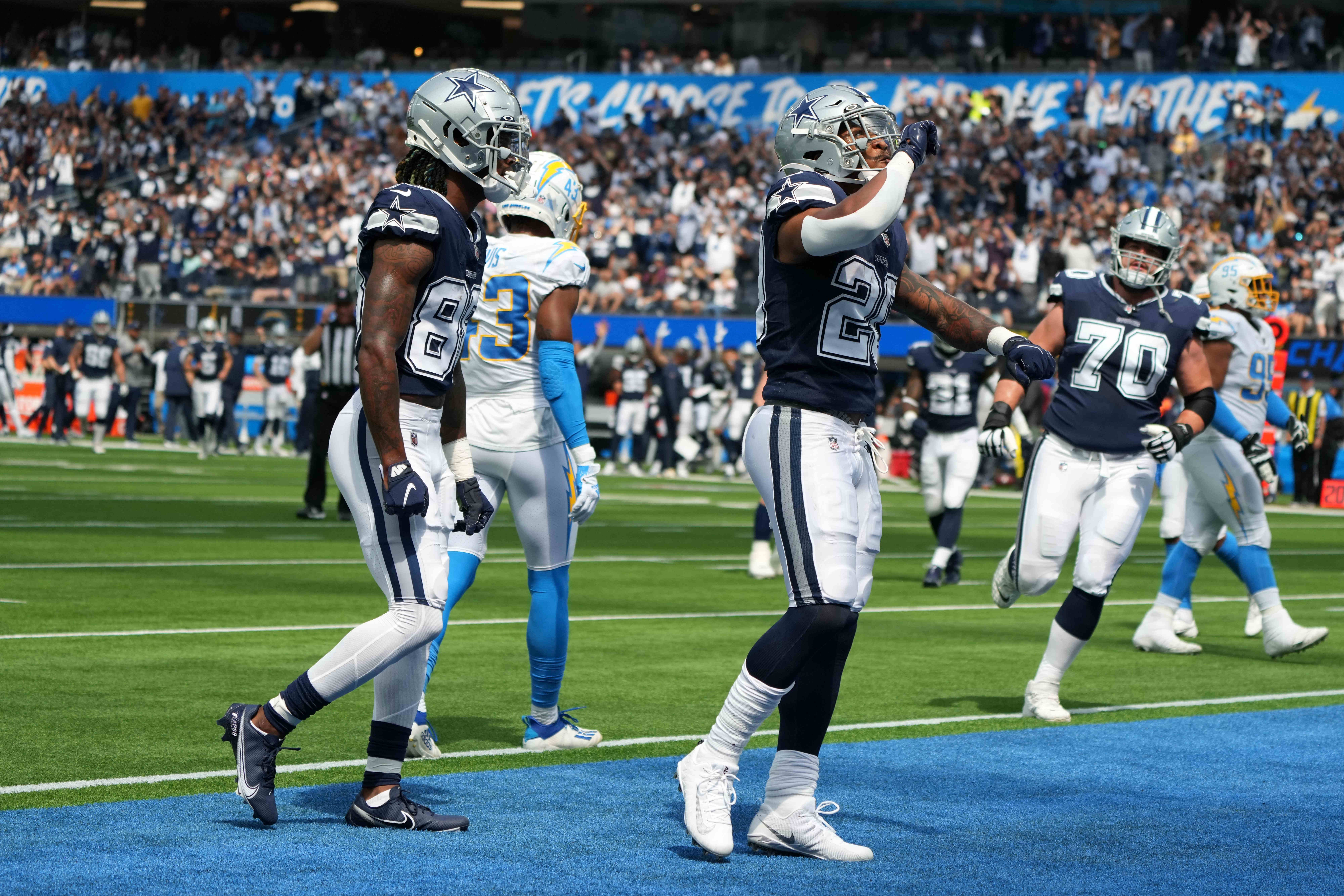 Sep 19, 2021; Inglewood, California, USA; Dallas Cowboys running back Tony Pollard (20) celebrates with wide receiver CeeDee Lamb (88) after scoring on a 4-yard touchdown run in the first quarter against the Los Angeles Chargers at SoFi Stadium. Mandatory Credit: Kirby Lee-USA TODAY Sports