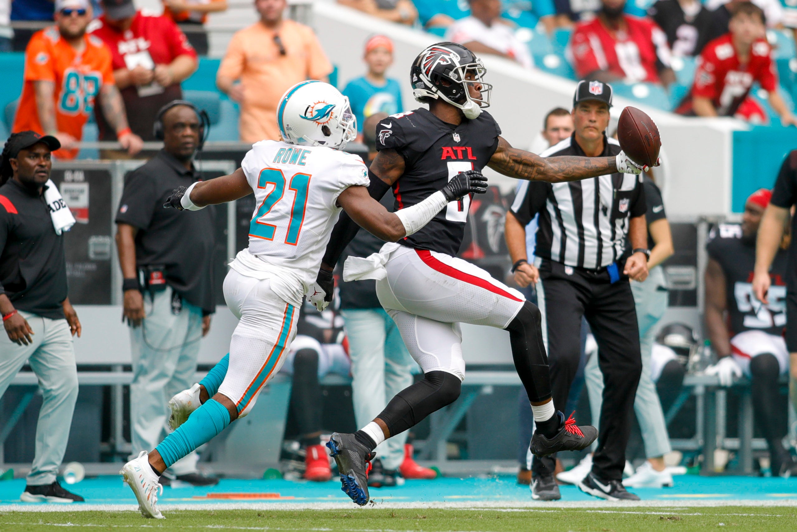 Oct 24, 2021; Miami Gardens, Florida, USA; Atlanta Falcons tight end Kyle Pitts (8) makes a one-handed catch against Miami Dolphins free safety Eric Rowe (21) during the second quarter of the game at Hard Rock Stadium. Mandatory Credit: Sam Navarro-USA TODAY Sports
