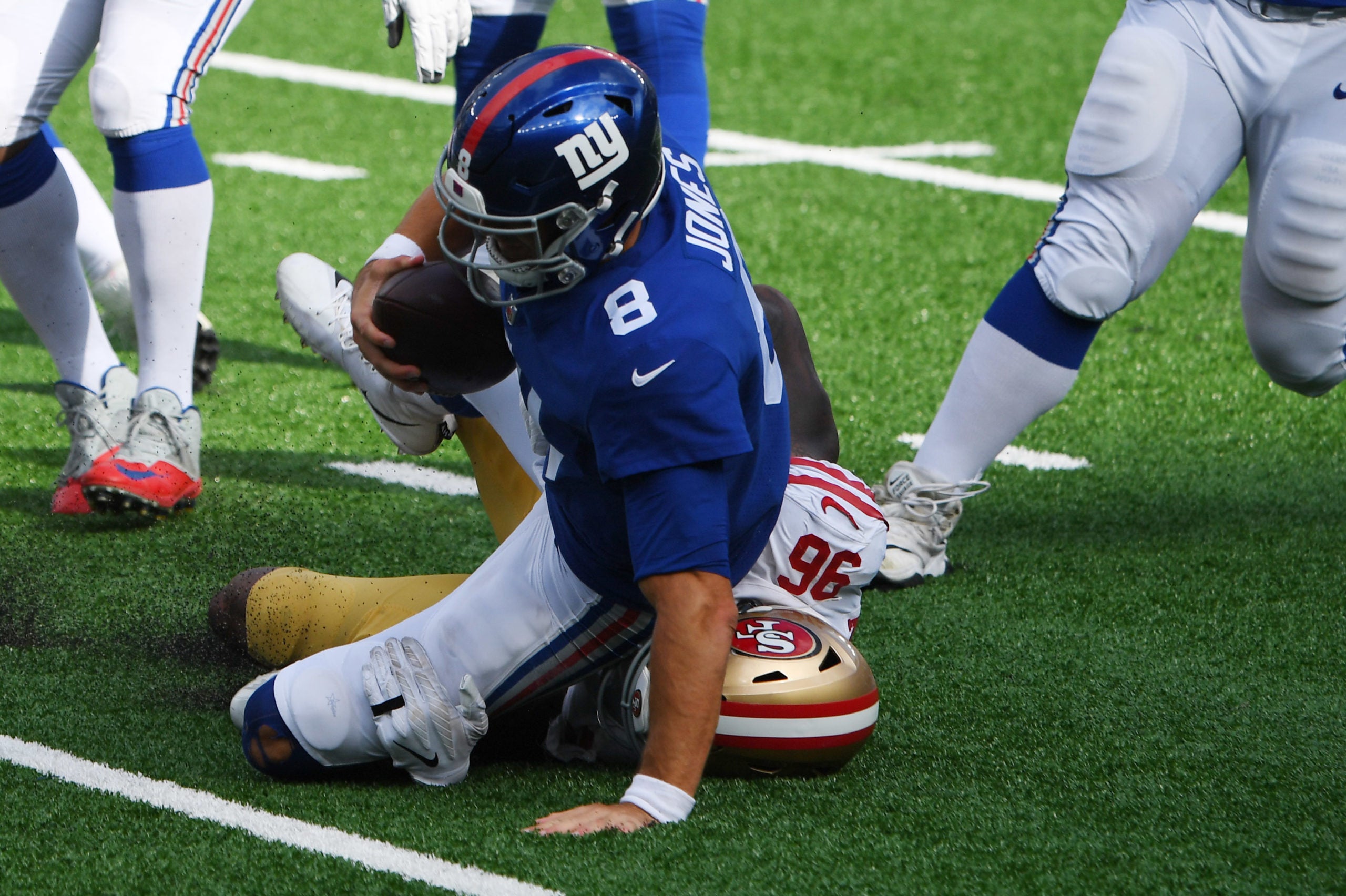 Sep 27, 2020; East Rutherford, New Jersey, USA; New York Giants quarterback Daniel Jones (8) is sacked by San Francisco 49ers player Dion Jordan (96) during the fourth quarter of a NFL football game at MetLife Stadium. Mandatory Credit: Robert Deutsch-USA TODAY Sports