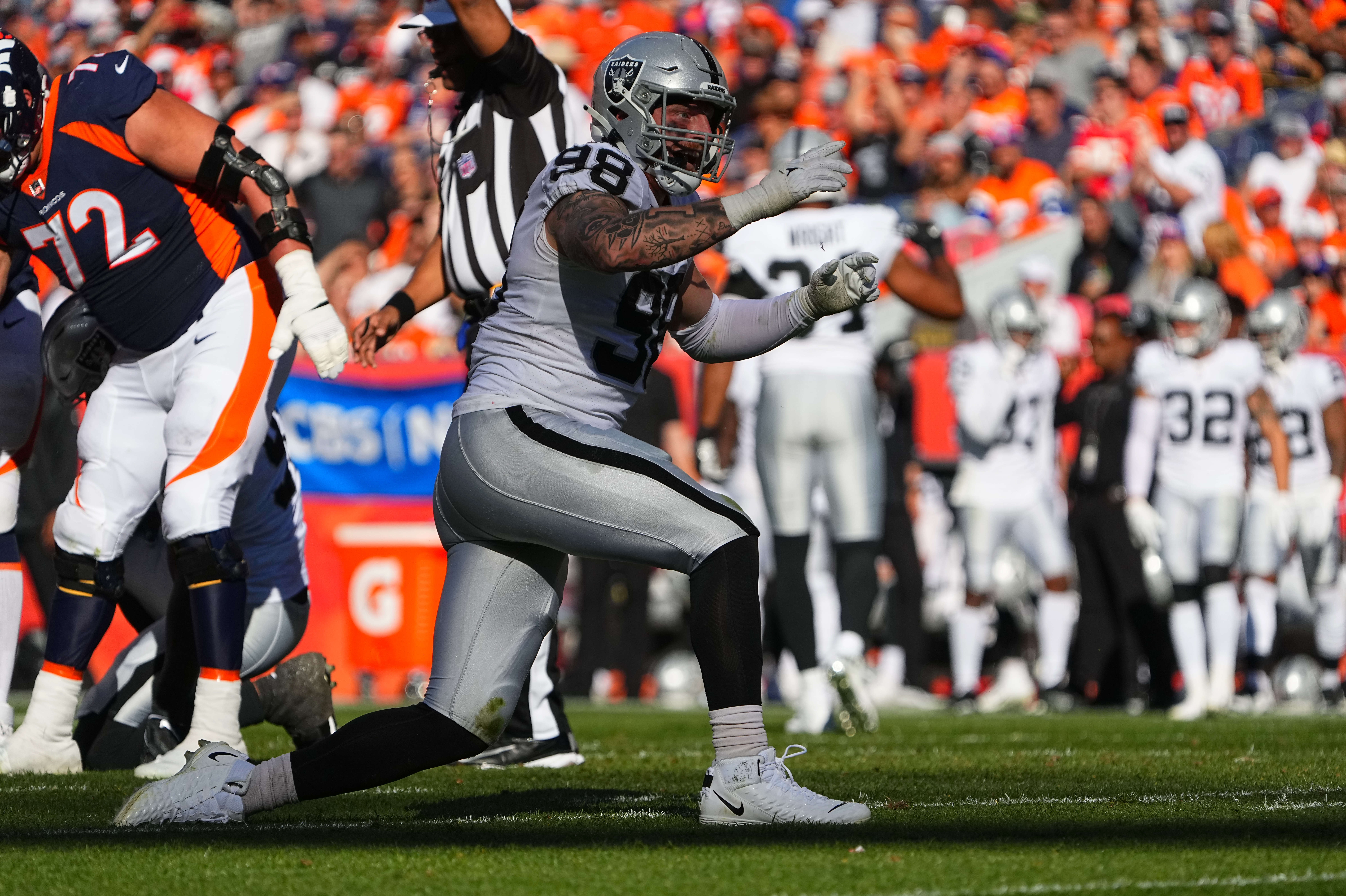 Oct 17, 2021; Denver, Colorado, USA; Las Vegas Raiders defensive end Maxx Crosby (98) celebrates his sack in the first half against the Denver Broncos at Empower Field at Mile High. Mandatory Credit: Ron Chenoy-USA TODAY Sports