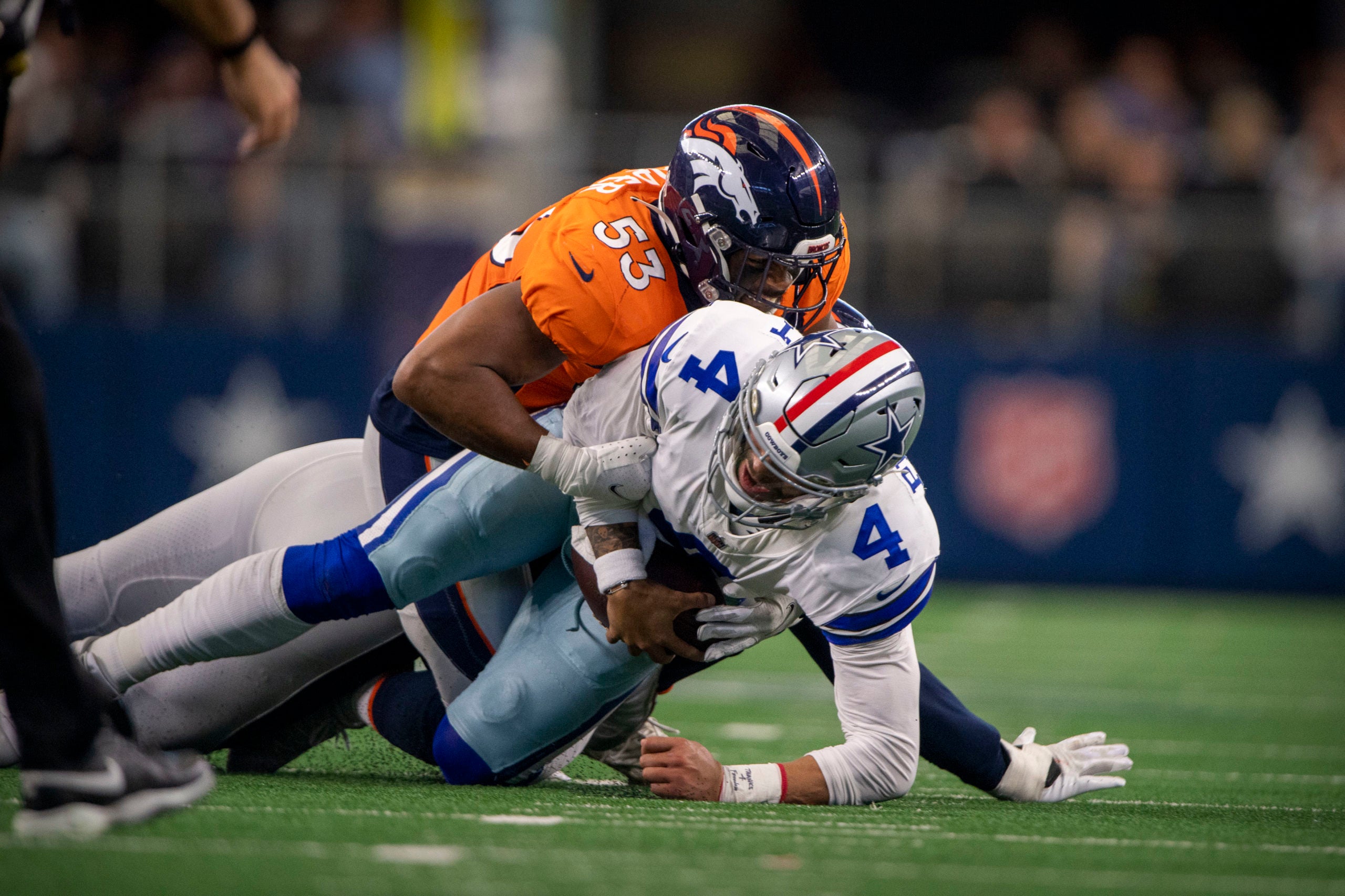 Nov 7, 2021; Arlington, Texas, USA; Dallas Cowboys quarterback Dak Prescott (4) is sacked by Denver Broncos linebacker Jonathon Cooper (53) during the second half at AT&T Stadium. Mandatory Credit: Jerome Miron-USA TODAY Sports